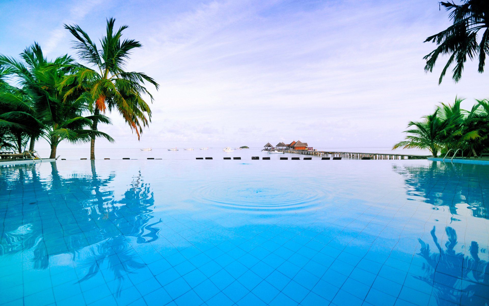 1920x1200 Tropical Oasis: Serene Man Made Pool HD Wallpaper
