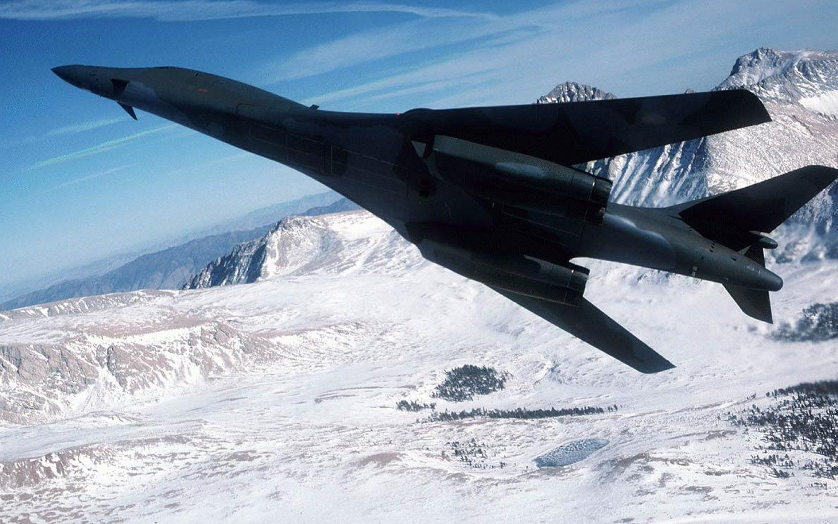 1680x1050 Rockwell B 1 Lancer Military Bomber HD Wallpaper In Flight Over Snowy Mountains