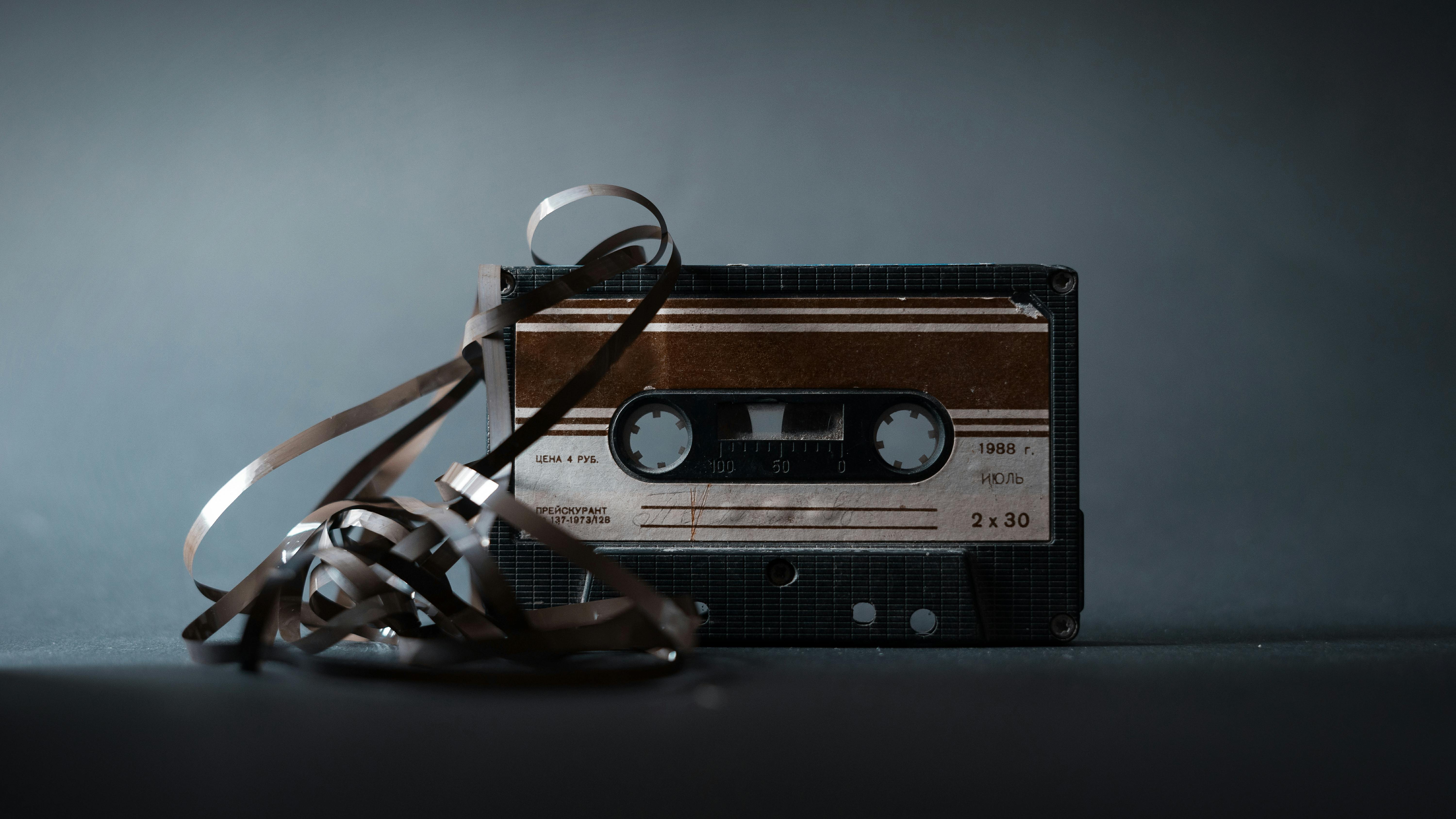 6000x3376 Retro cassette with tape on gray background · Free