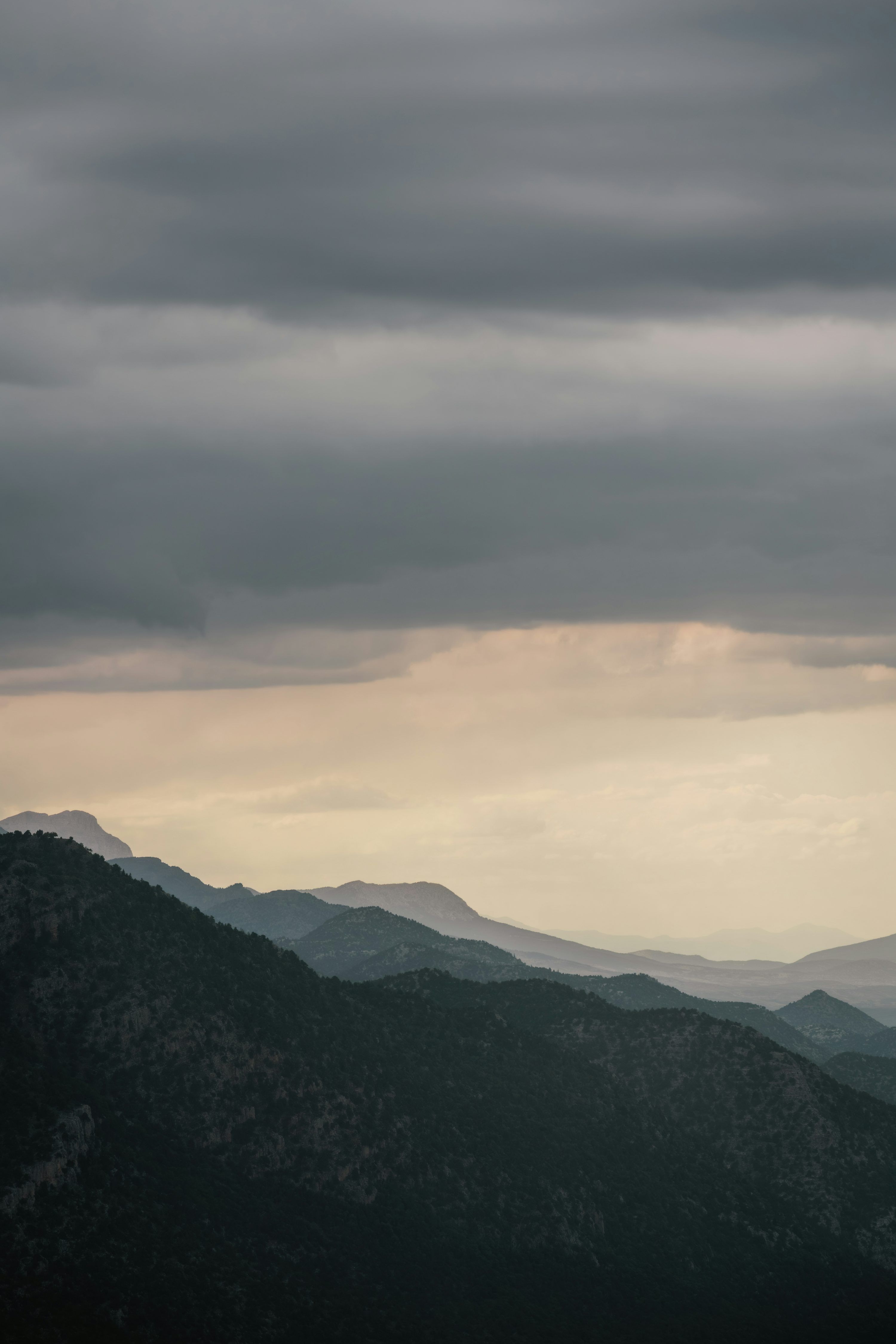 3000x4498 Overcast sky above mountain ranges. photo