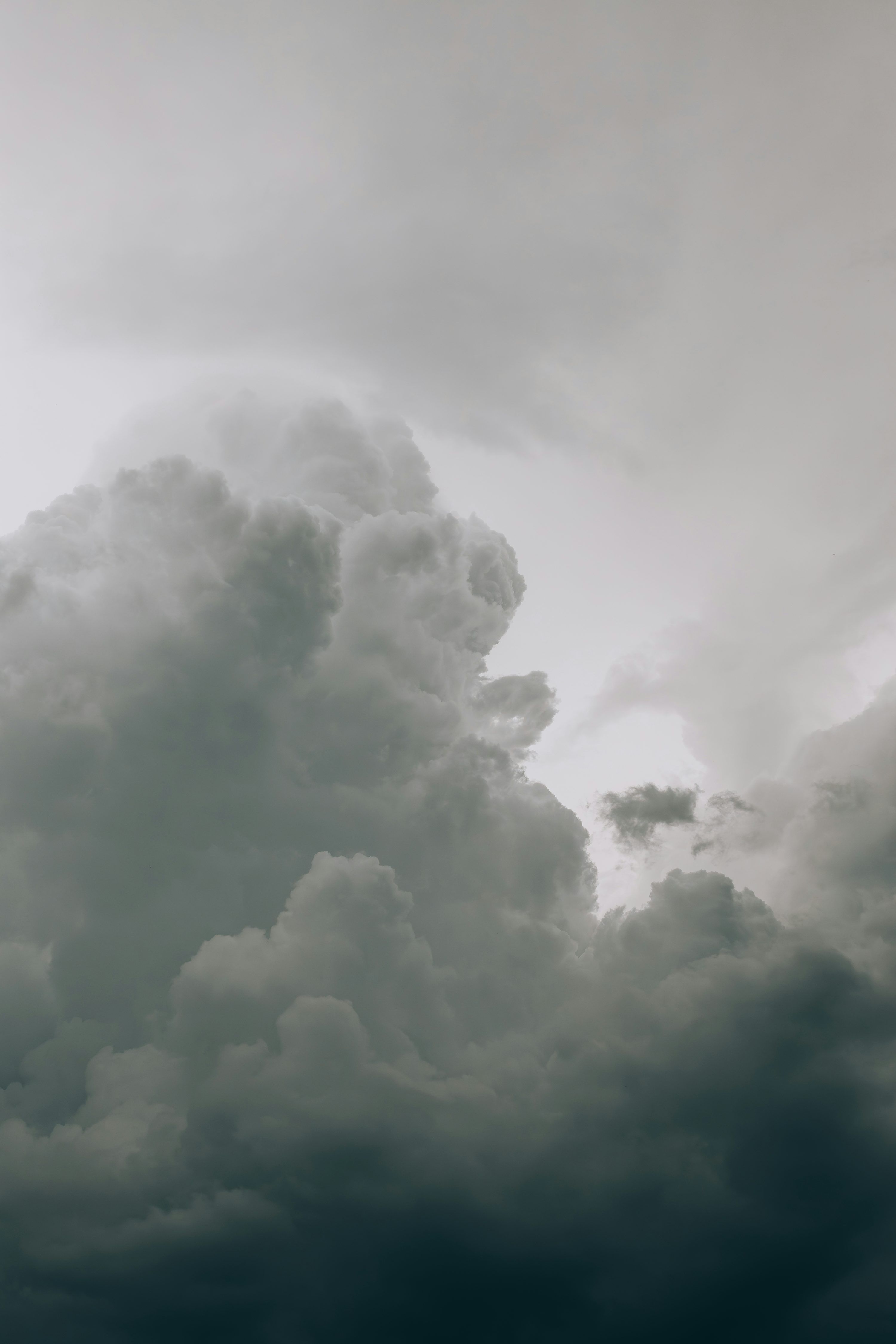 3000x4500 Overcast sky filled with dramatic, dark clouds. photo