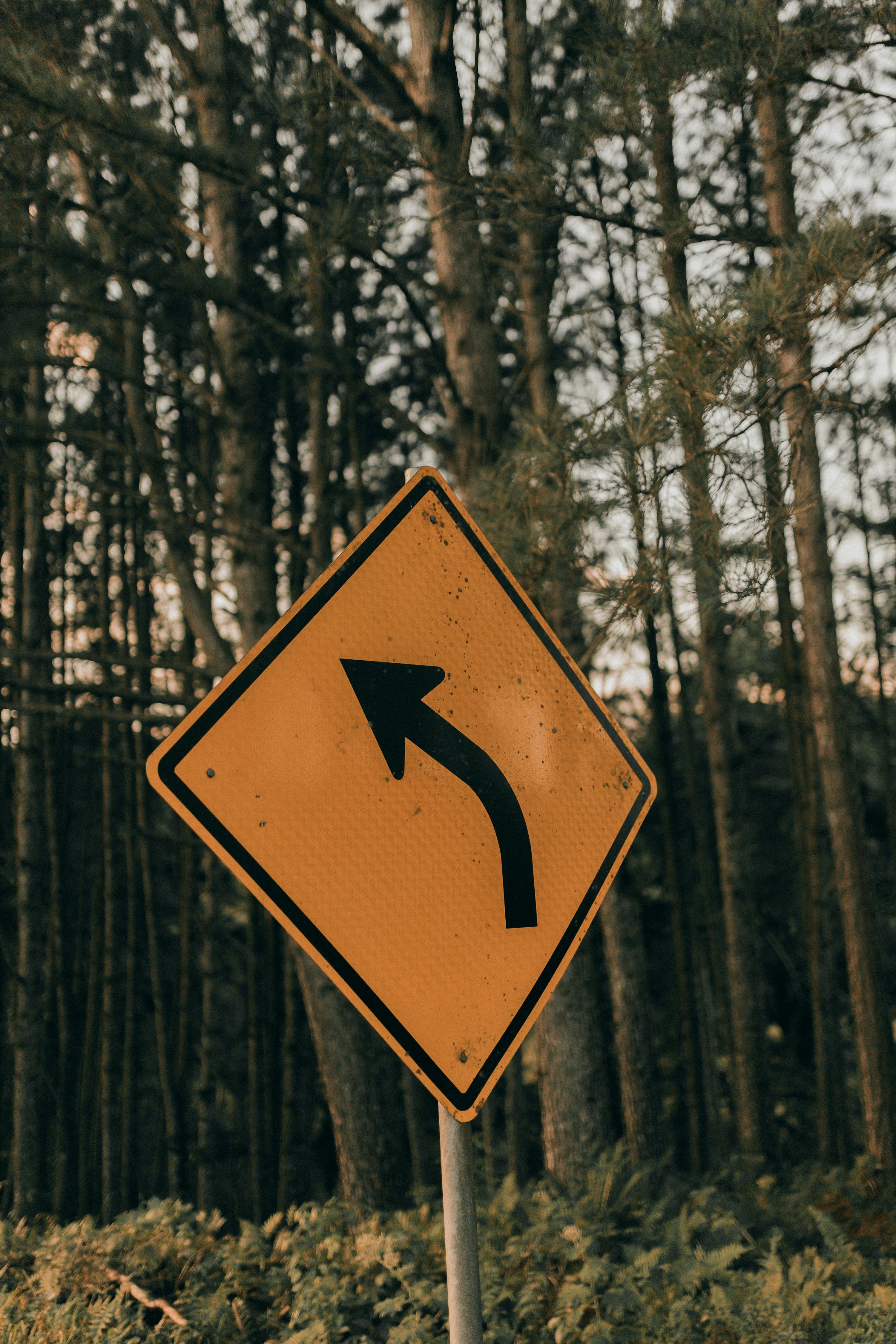 3000x4500 A street sign with an arrow pointing to the right photo