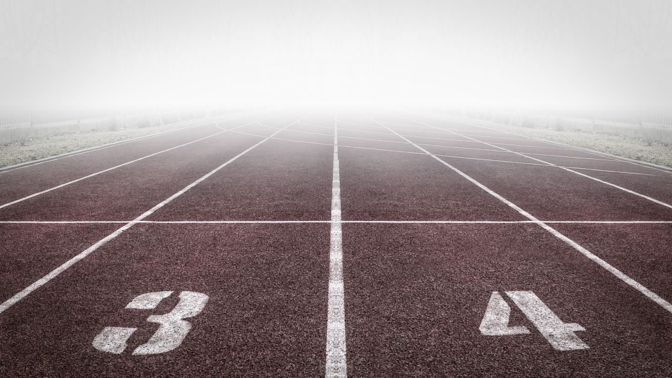 1333x750 Wallpaper White Arrow Sign on Green and White Track Field, Background Free Image