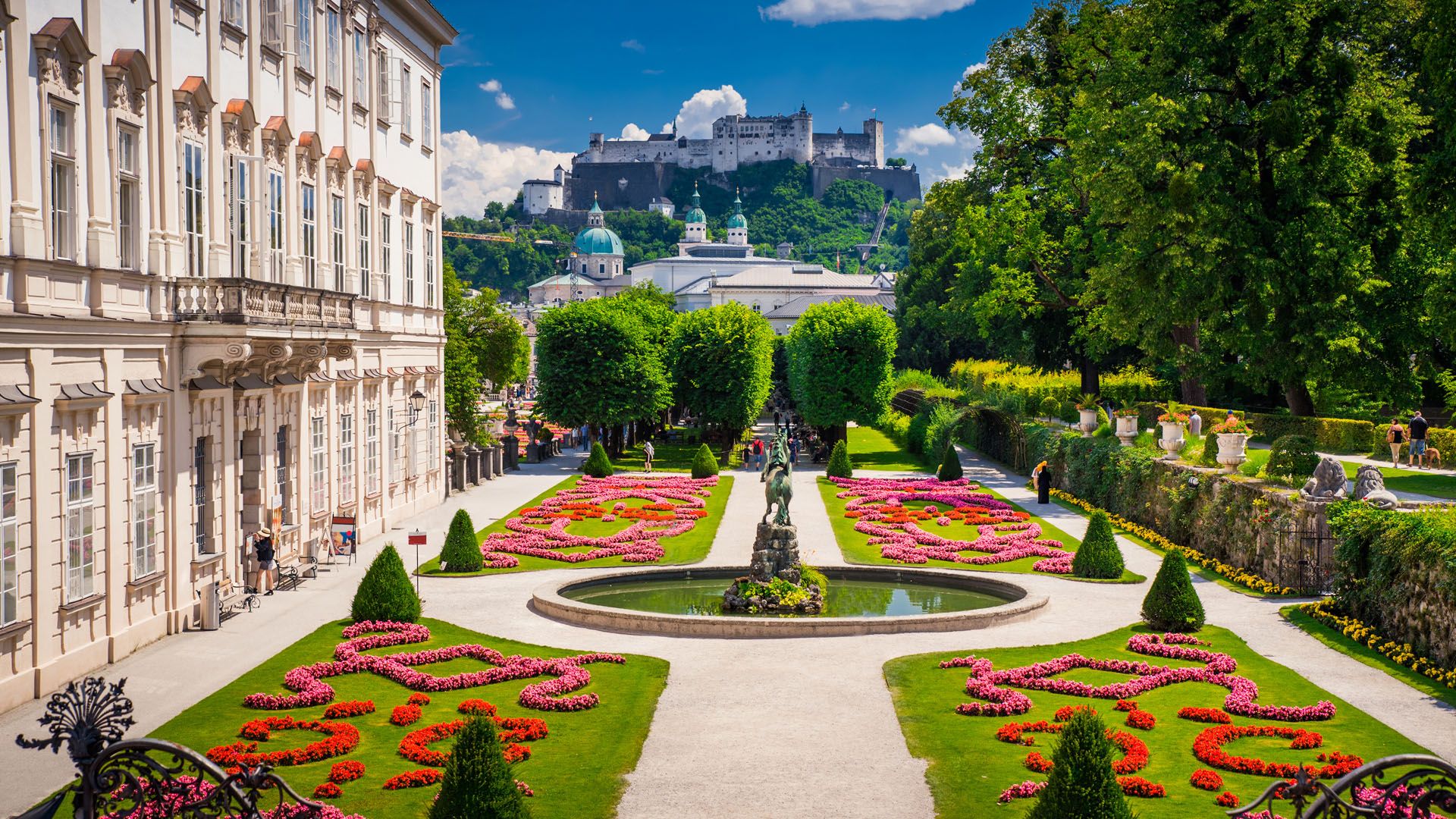 1920x1080 Mirabell Palace and Gardens in summer, Salzburg castle in background, Austria. Windows Spotlight Image