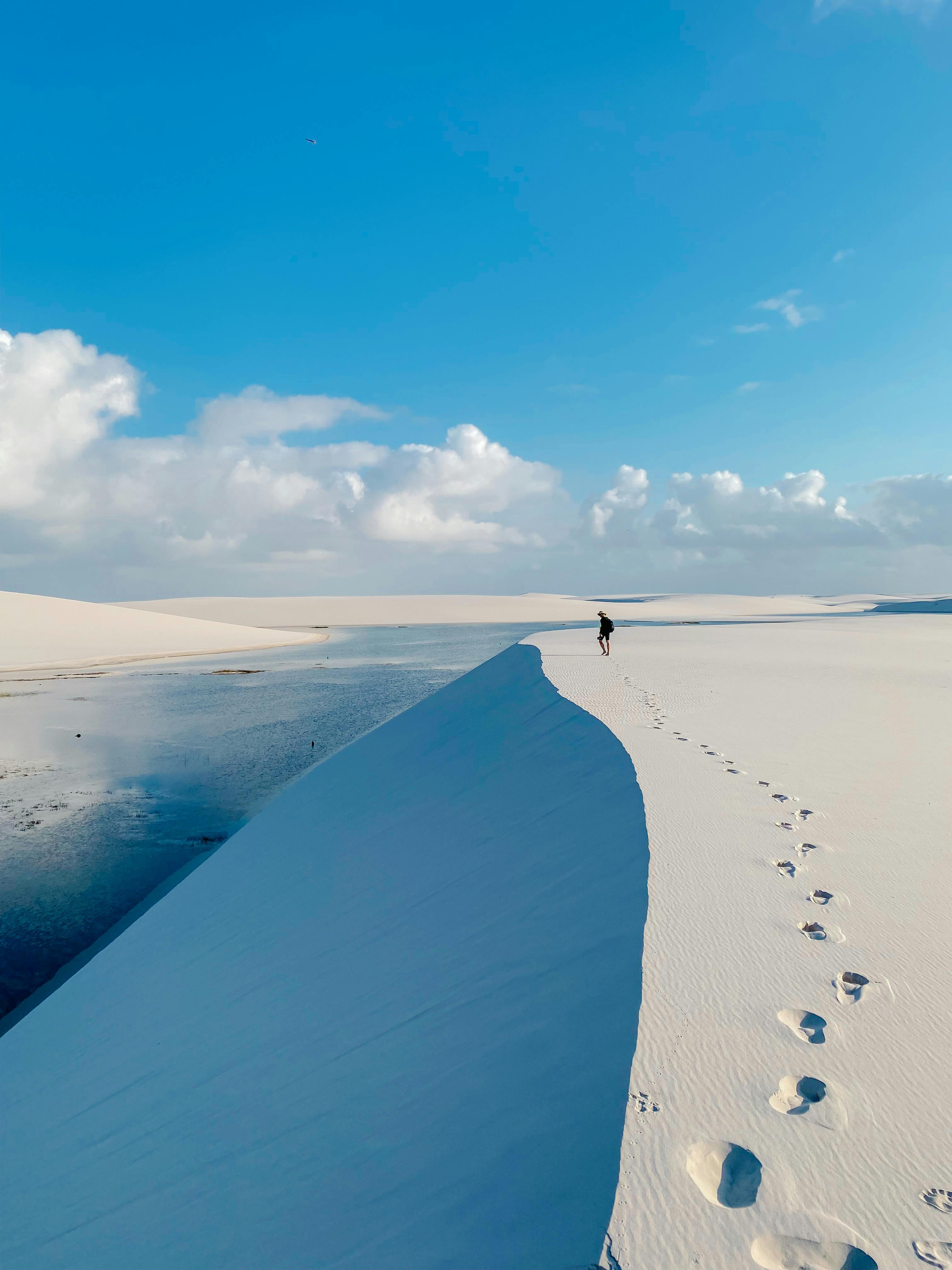 3024x4032 Woman Sitting on Dune in Lencois Maranhenses National Park in Brazil · Free