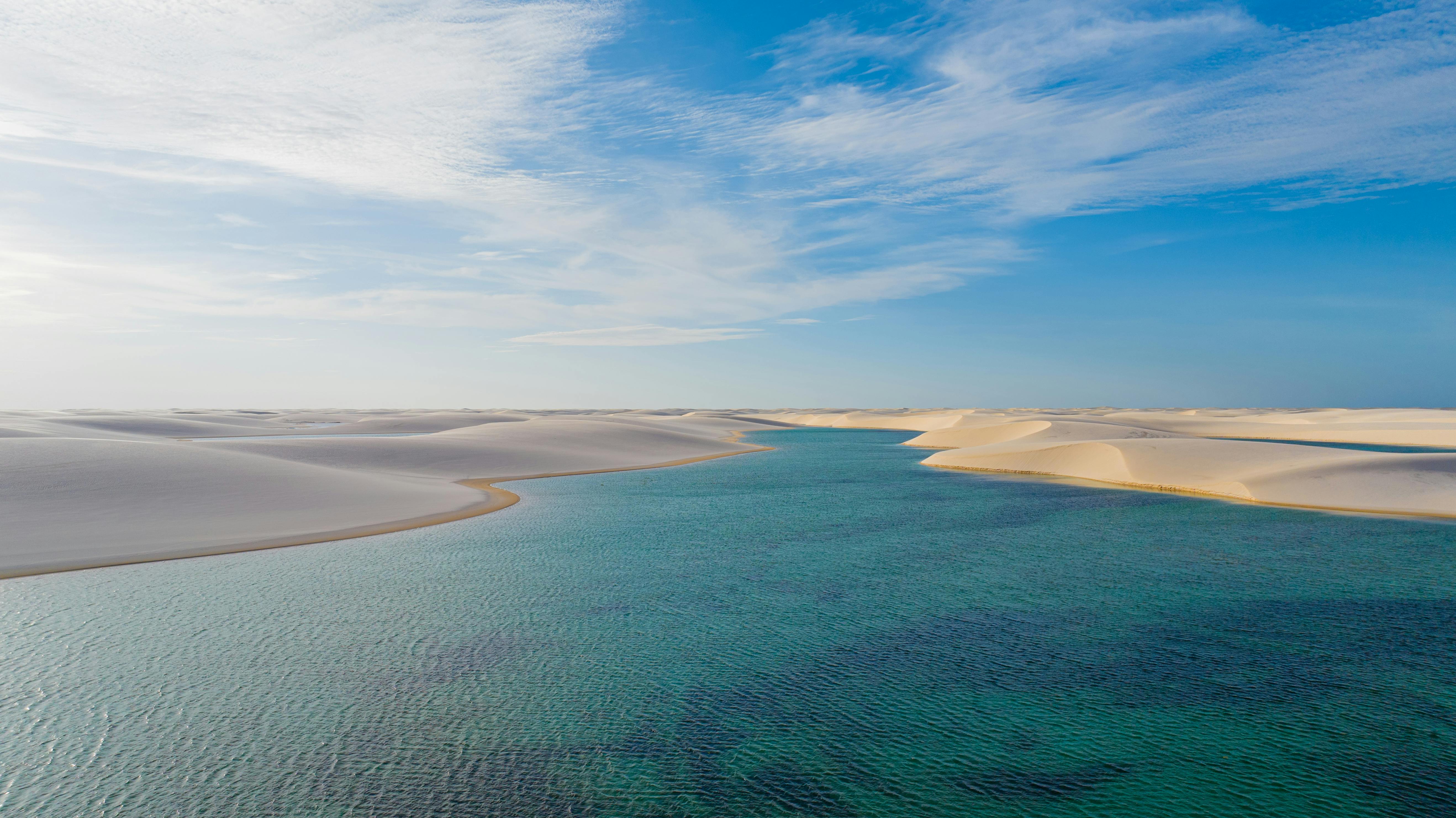 5272x2962 Woman Sitting on Dune in Lencois Maranhenses National Park in Brazil · Free