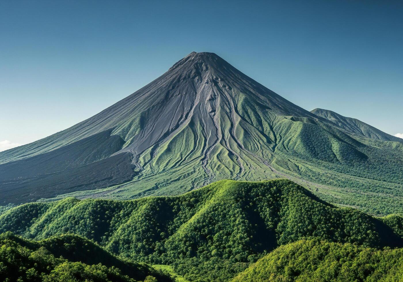 1400x980 Nature background, Nature wallpaper, Majestic volcano with lush green vegetation covering the lower slopes under a clear blue sky