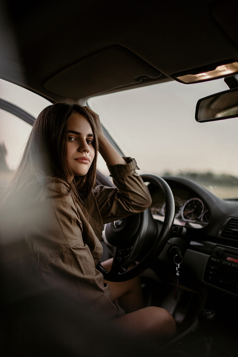 800x1200 Woman sitting inside car, HD phone wallpaper