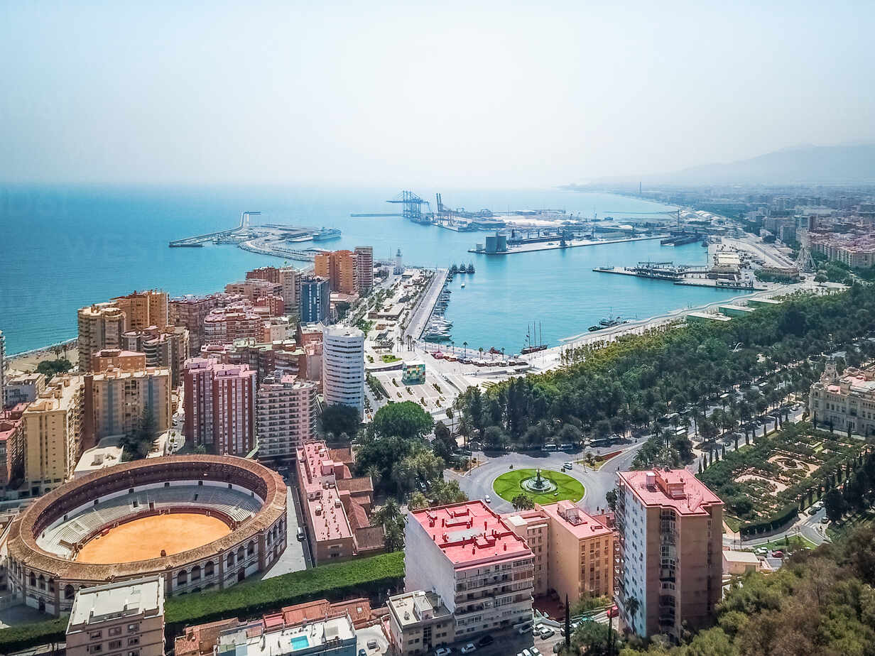 1232x924 Aerial view of La Malagueta Bullring with the tall building around it and the port of Malaga in the background, Andalusia, Spain