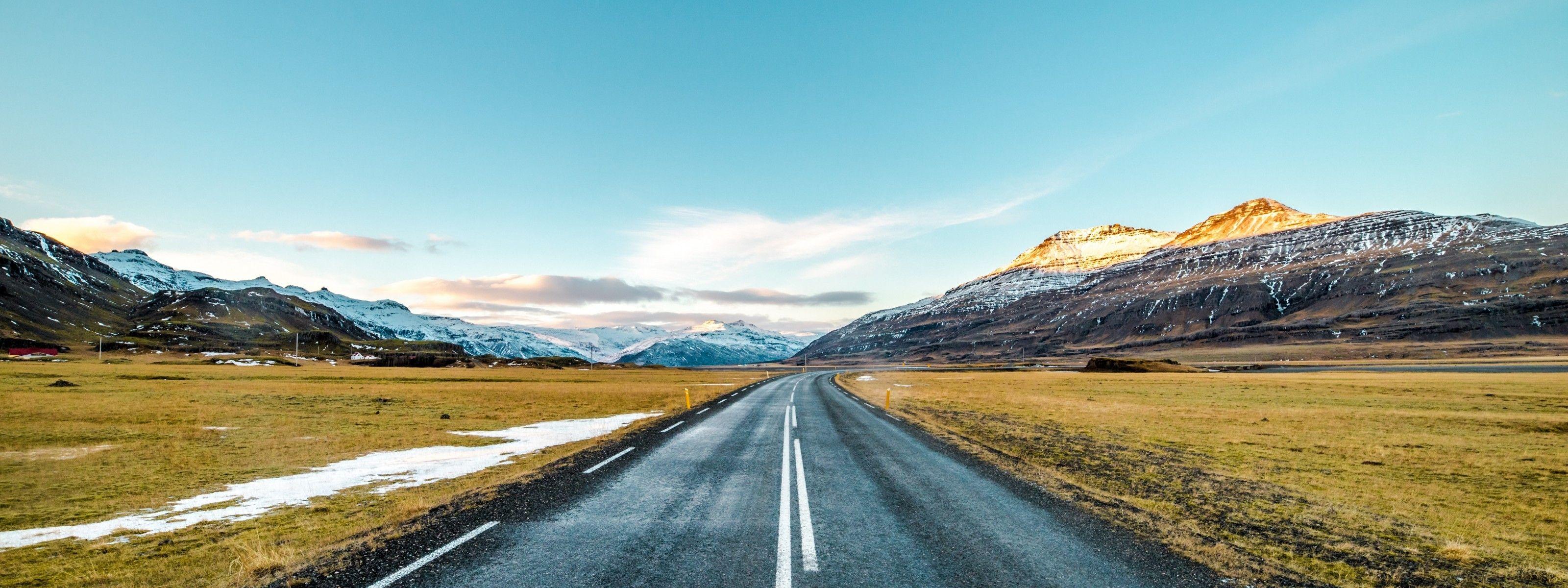3200x1200 Download 3200x1200 Long Road, Field, Clean Sky, Snow, Mountains