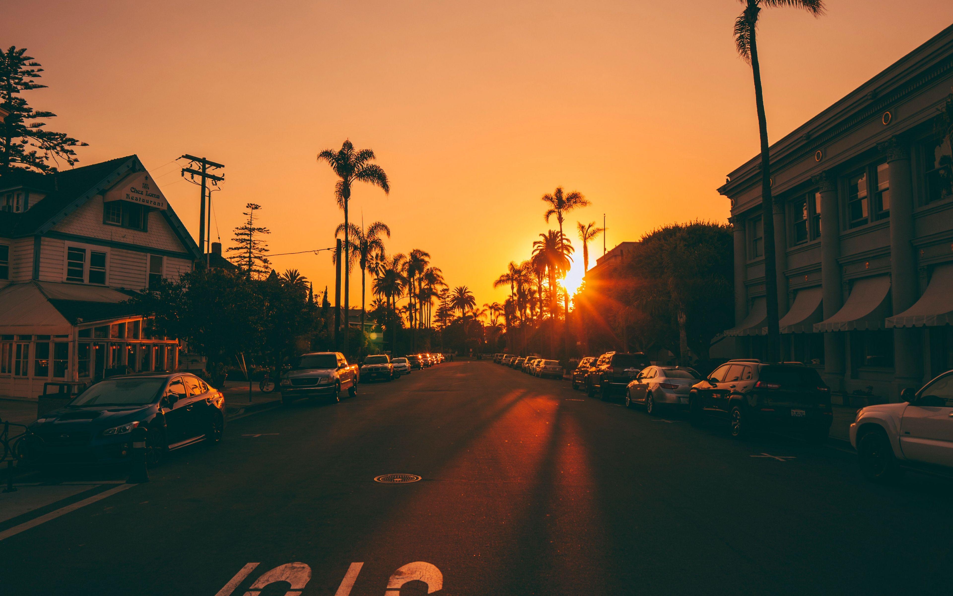 3840x2400 Download wallpaper 3840x2400 street, sunset, palm trees, road