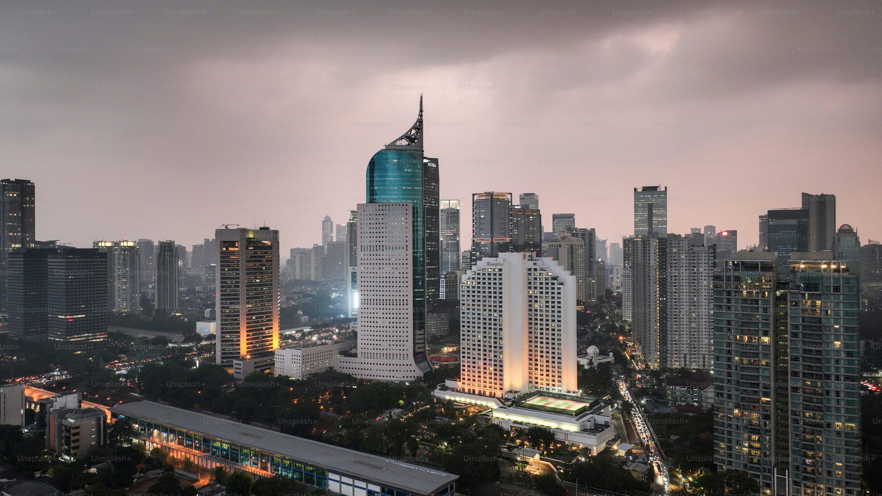 3000x1688 Jakarta downtown buildings at sunset. Bekasi, Indonesia November 24 2023 photo