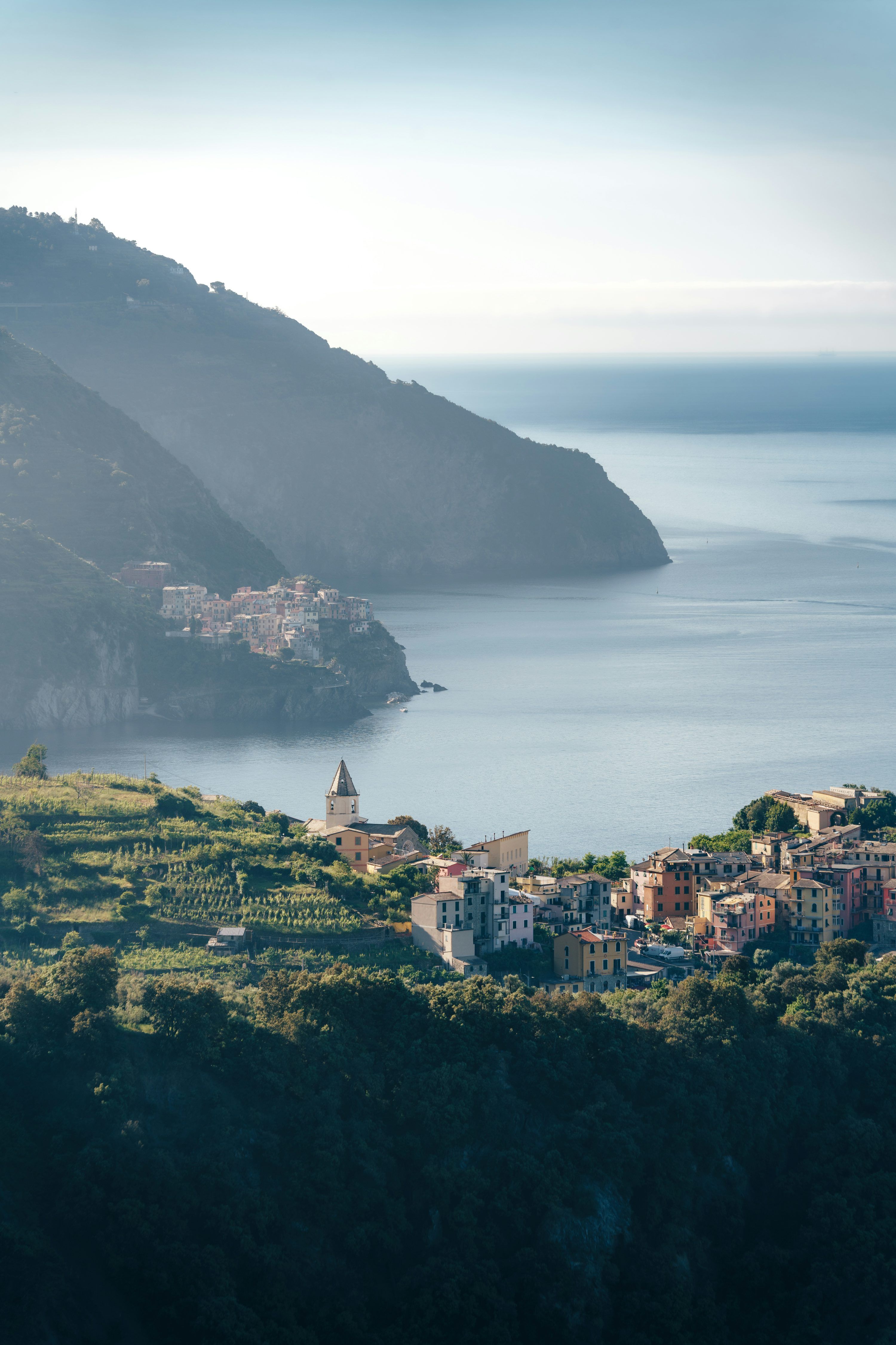 3000x4499 A coastal village nestled between mountains and the sea. photo
