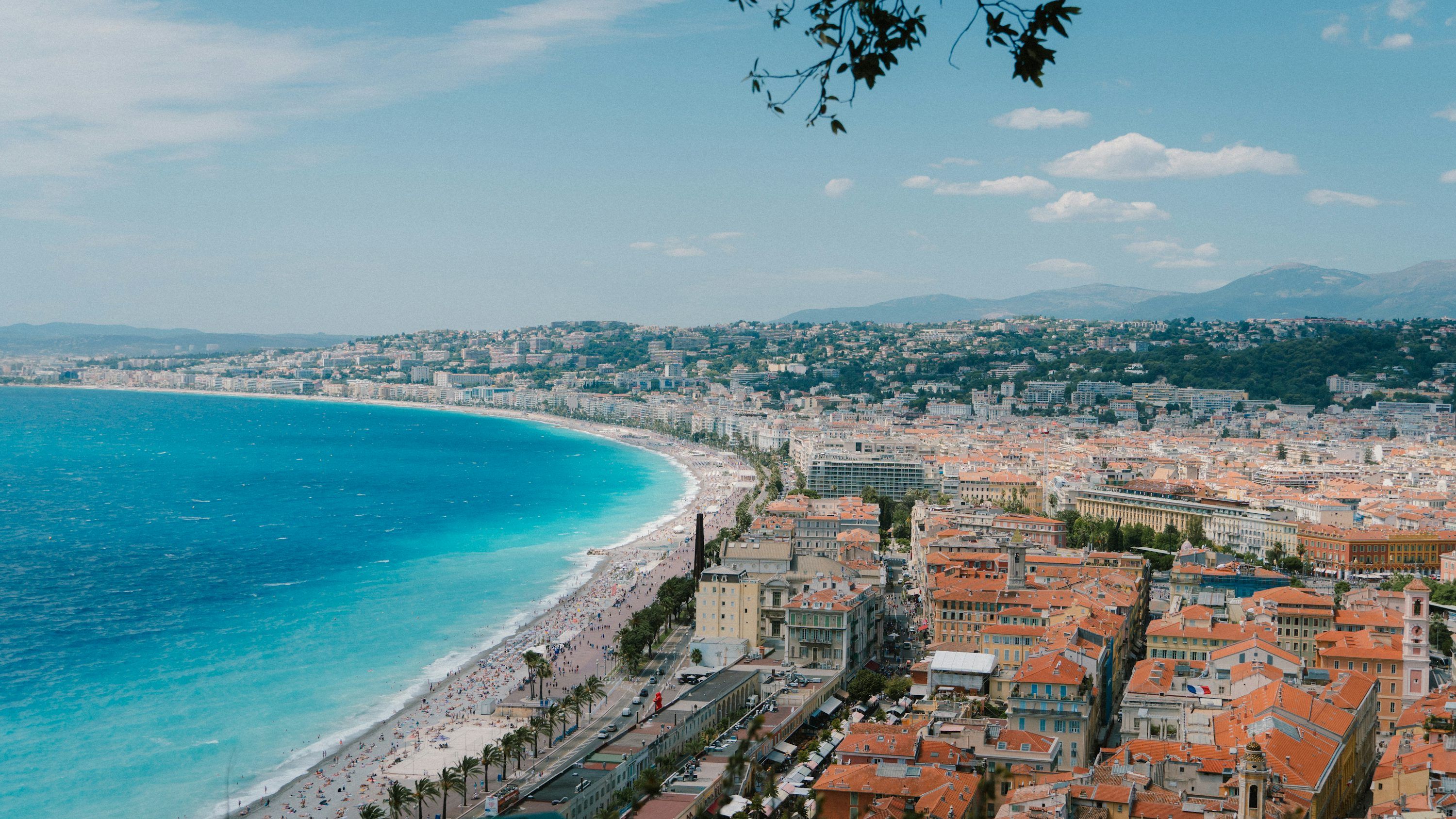3000x1688 Coastal city with blue ocean and beach. photo