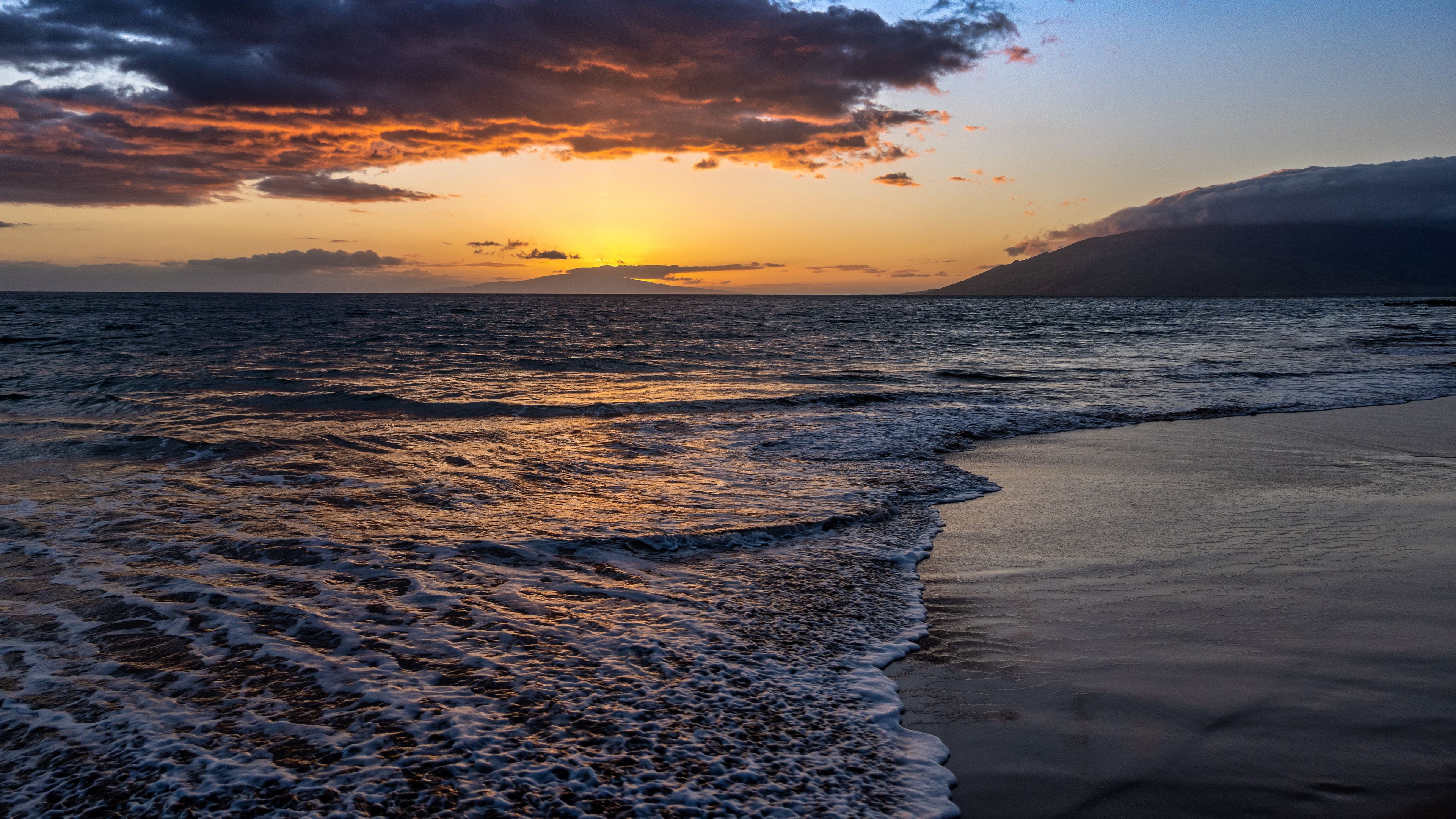 3840x2160 Beautiful Sea Coast Beach Sand Ocean Waves Landscape View Of Mountains During Sunset Silhouette Background 4K HD Nature Wallpaper
