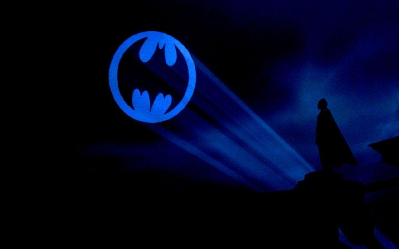 Download Caption The Iconic Bat Signal Shining in the Night Sky Wallpaper   Wallpaperscom