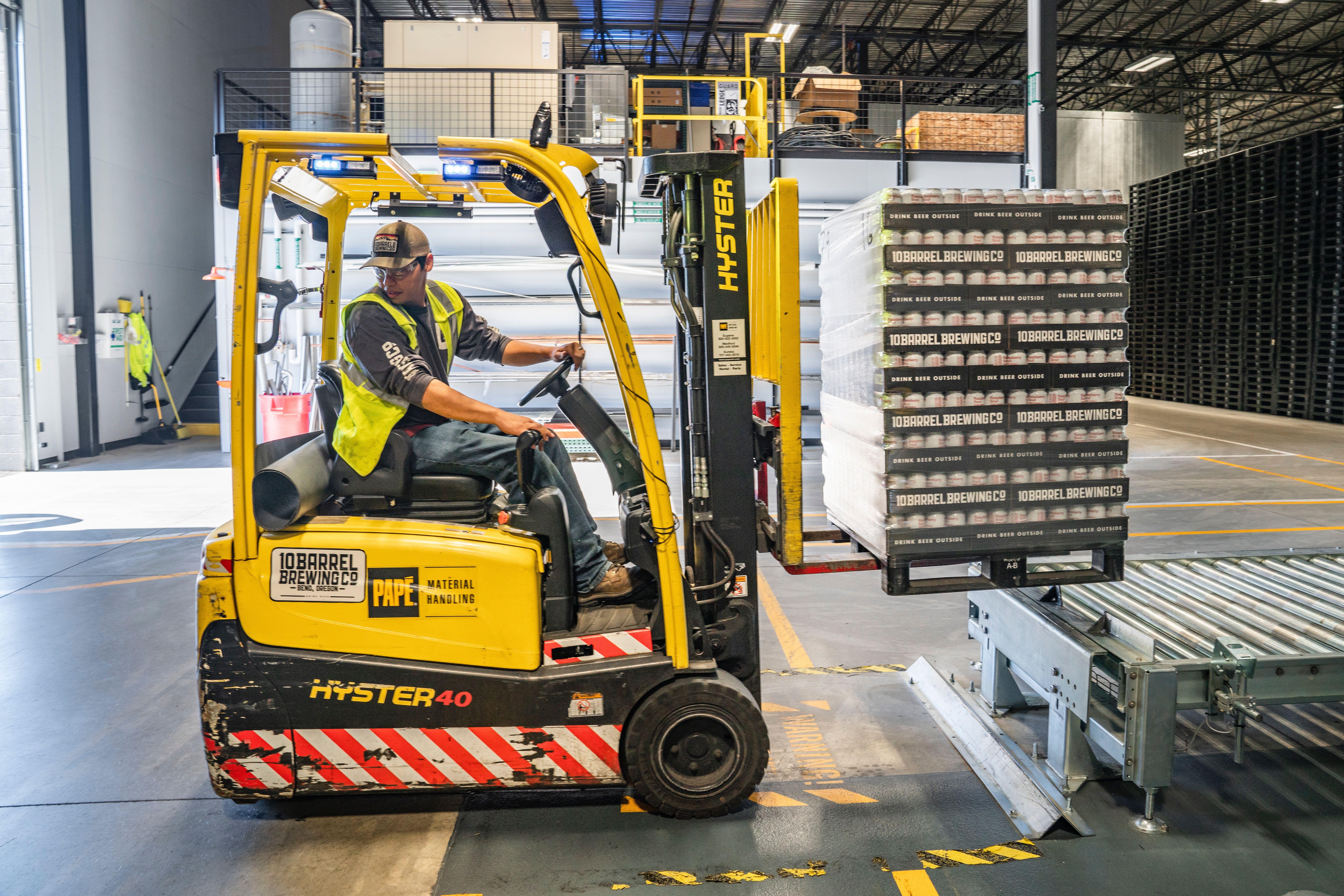 7273x4851 Person Using Forklift · Free