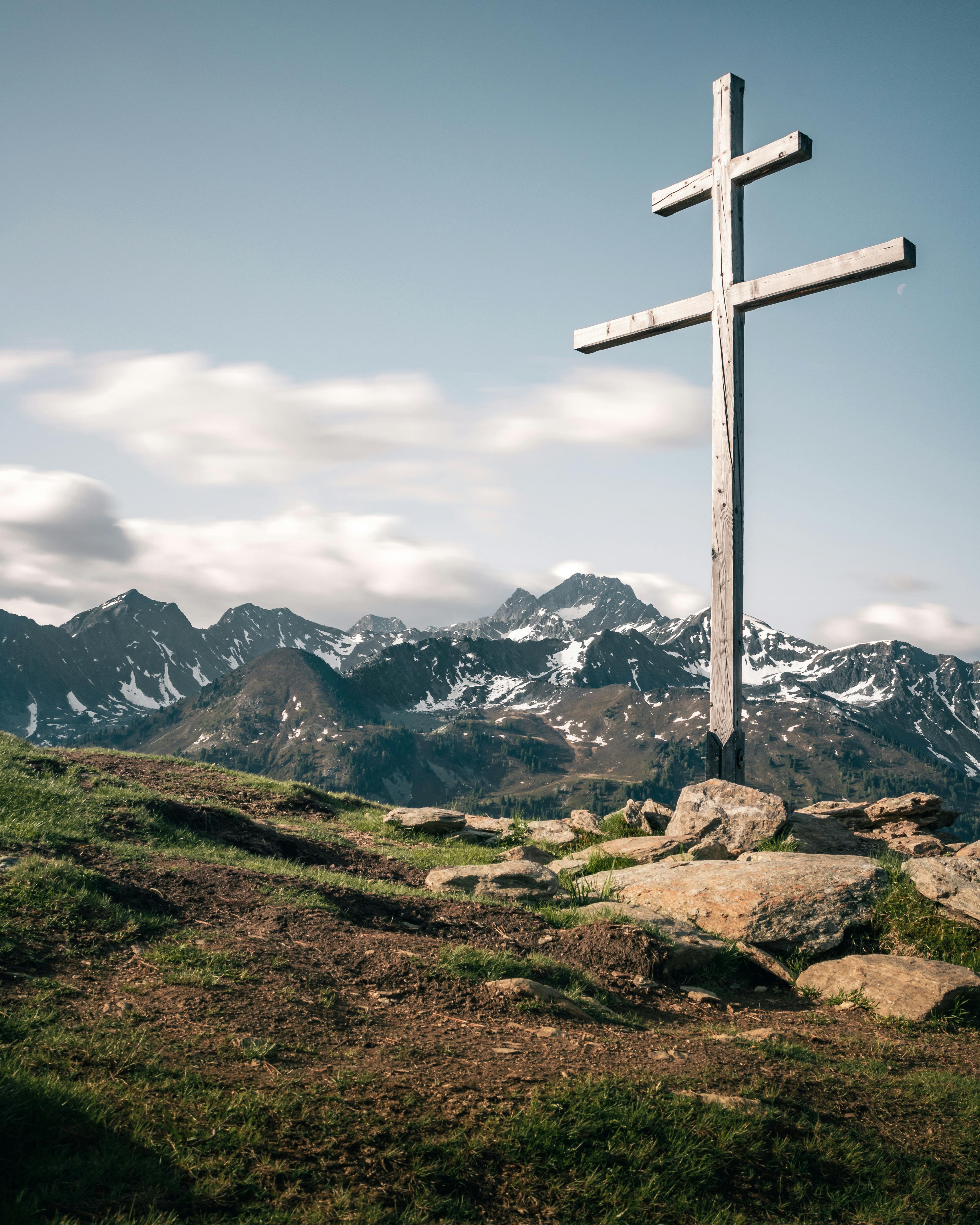 3926x4907 A Wooden Crucifix Against the Rock Mountains · Free
