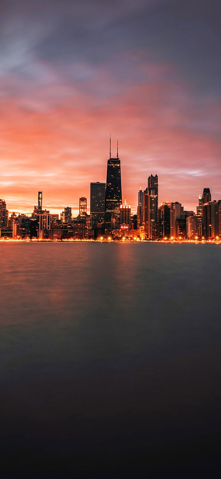 720x1560 Dark City Skyline Next To A Lake 4K Phone Wallpaper