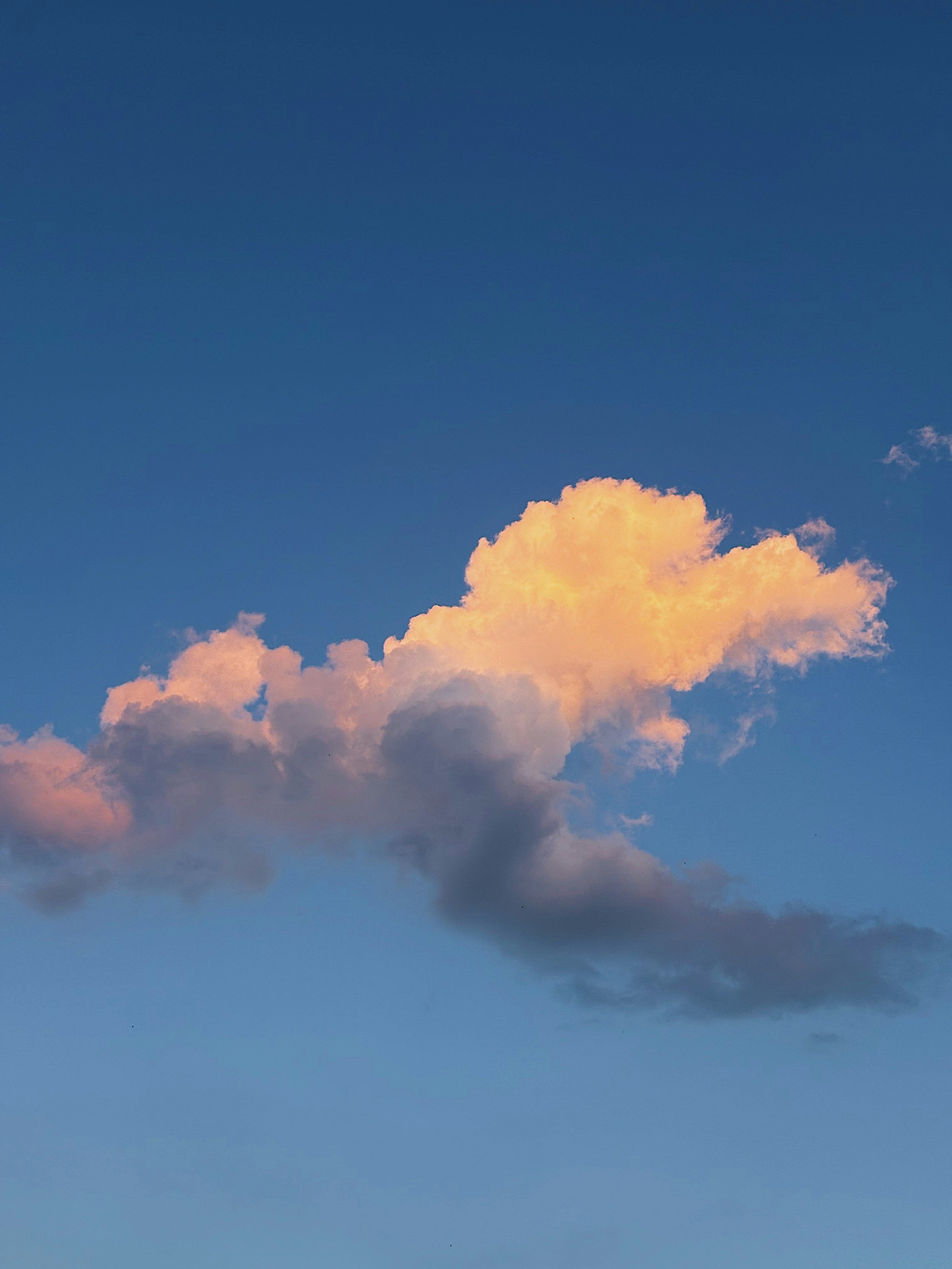 3000x4000 A cloud with light colors shines. photo