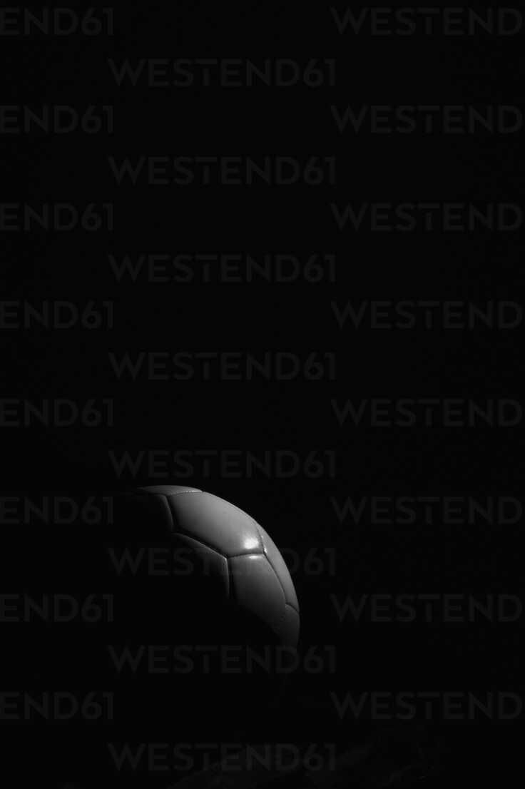 736x1106 Soccer ball on black background