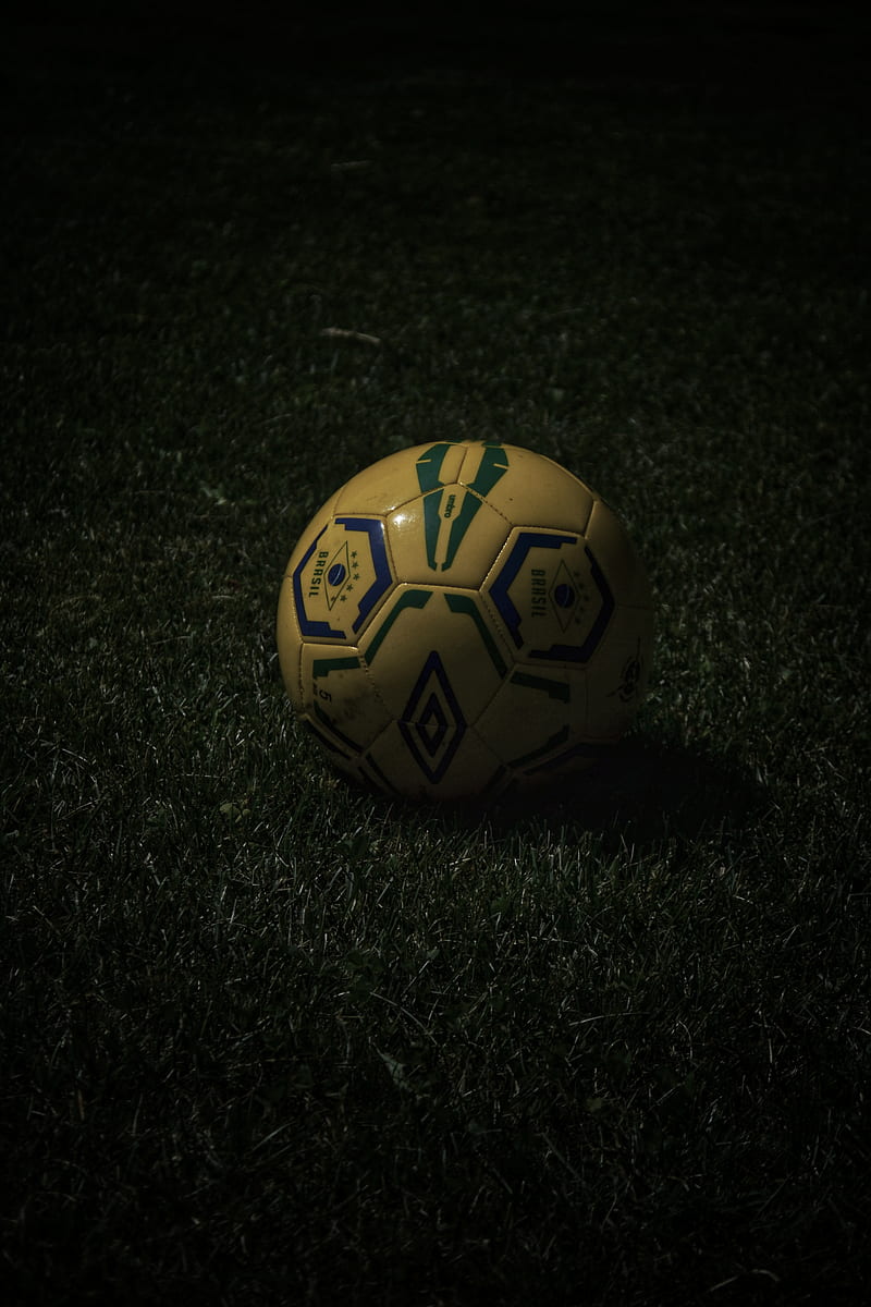 800x1200 Yellow and black soccer ball on green grass, HD phone wallpaper