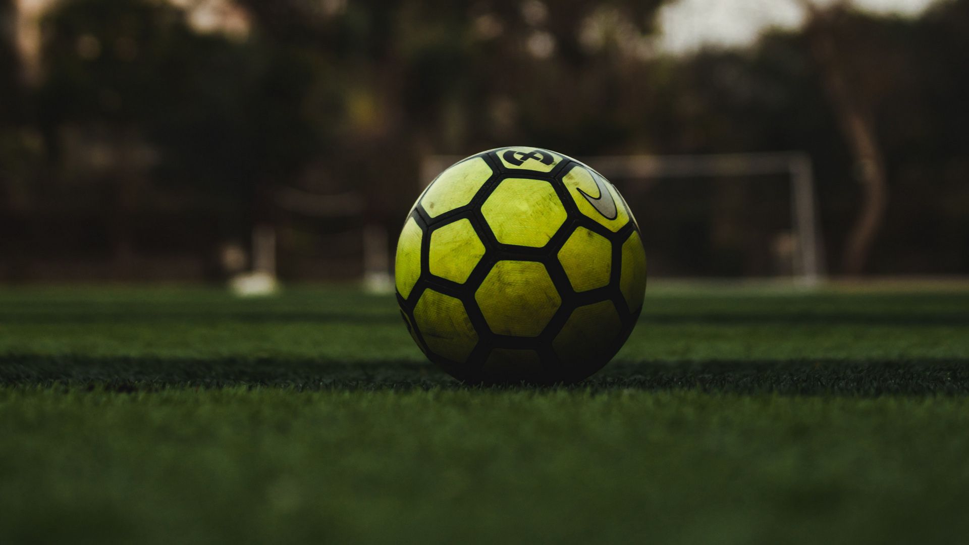 1920x1080 Green Black Football On Grass In Blur Background HD Football Wallpaper