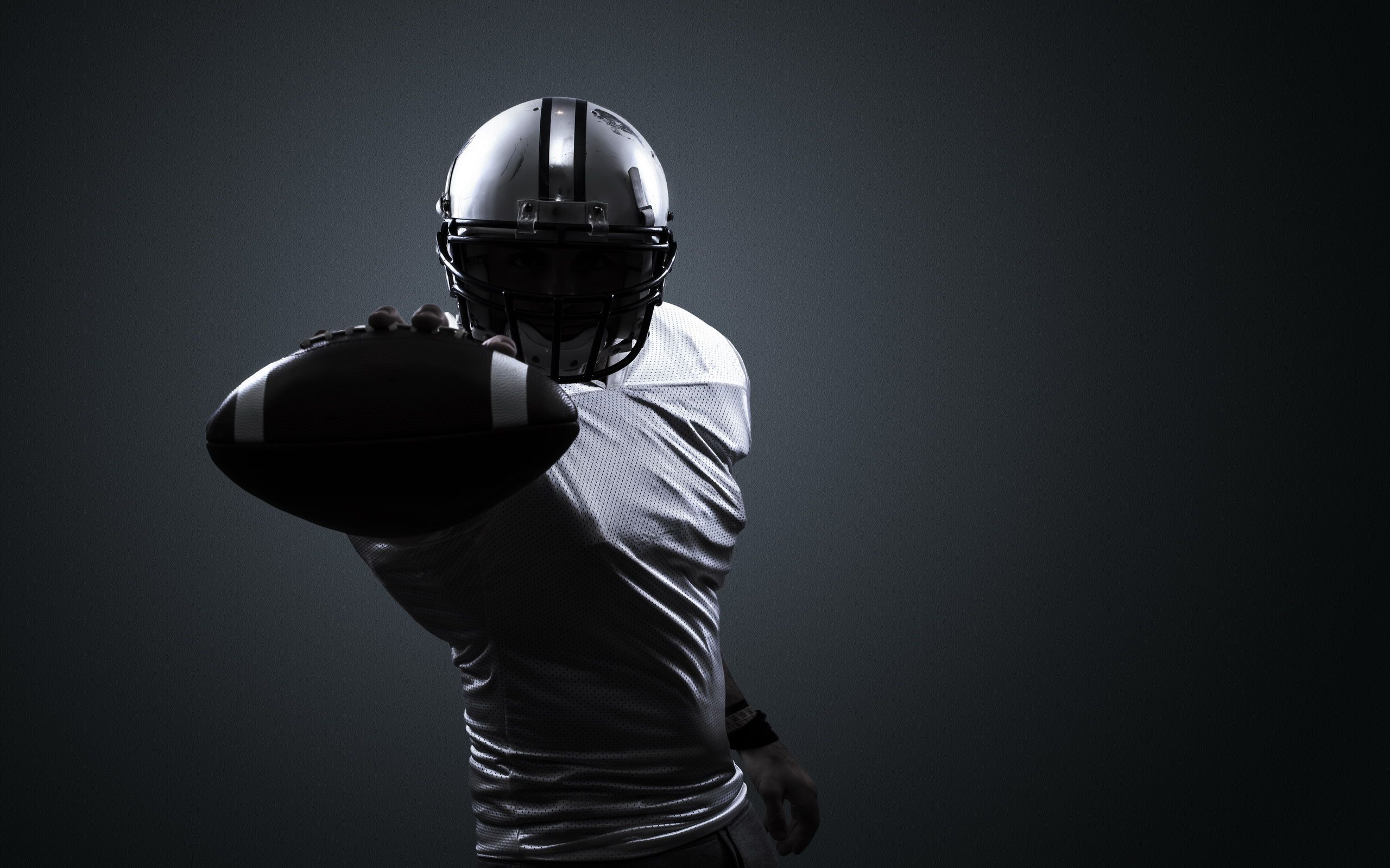 2560x1600 Ultimate Football Action HD Wallpaper: Power Meets Precision in Sports