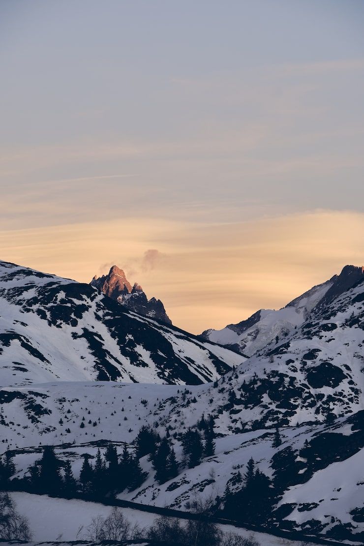 740x1110 Snowy mountain sunset Image