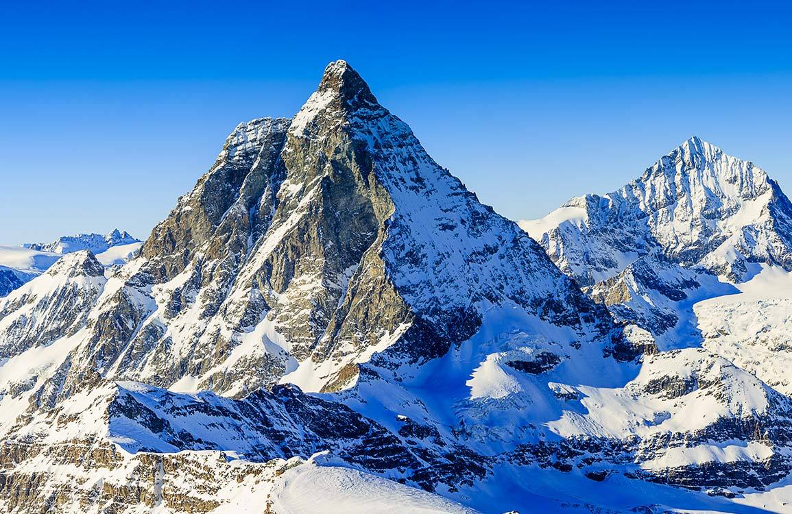 1155x750 Stunning Alpine Mountain Landscape Mural Wallpaper in Serene Cool Tones
