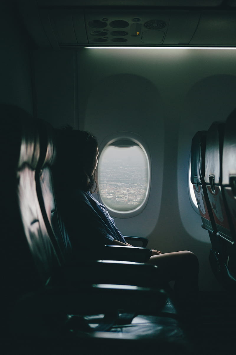 800x1202 Woman sits on seat near window inside plane, HD phone wallpaper