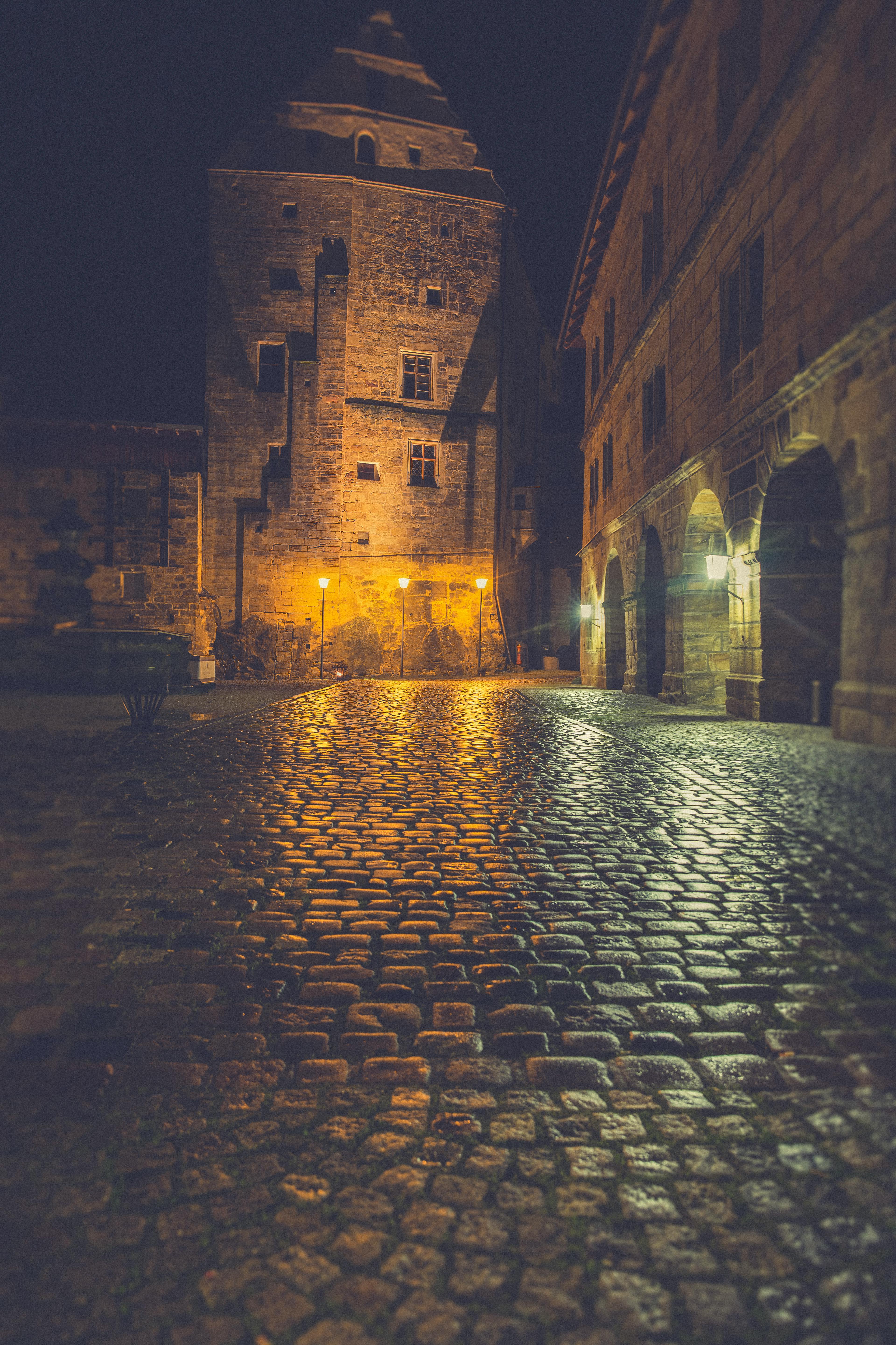3840x5760 Free of alley, ancient, arched windows, architecture, brick, building facade, candlelight glow, castle, charming, cobblestone, cultural heritage, dark, empty street, europe, european architecture, evening, gothic architecture, historic