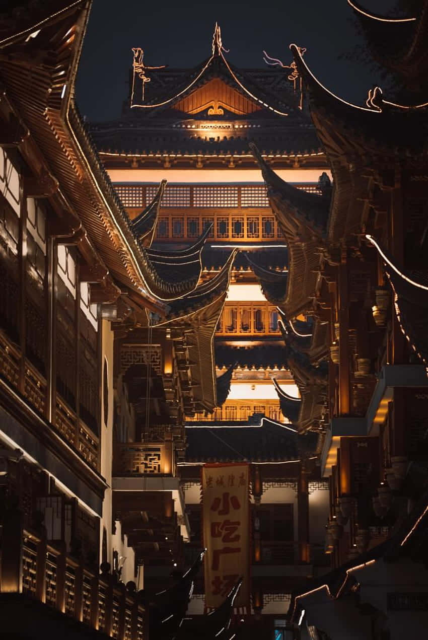 850x1271 Download Traditional Chinese Architectureat Night Wallpaper
