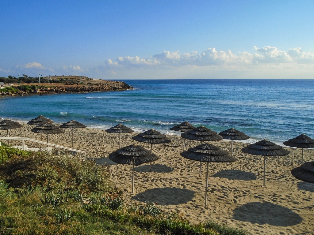 1024x768 A beach with many umbrellas on the sand. Cyprus ayia napa nissi beach Domain Media Search Engine Public Domain Search