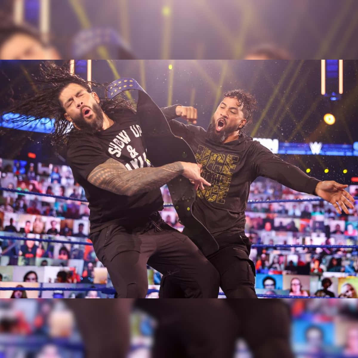 1200x1200 Download WWE's Jey Uso in action against Roman Reigns Wallpaper