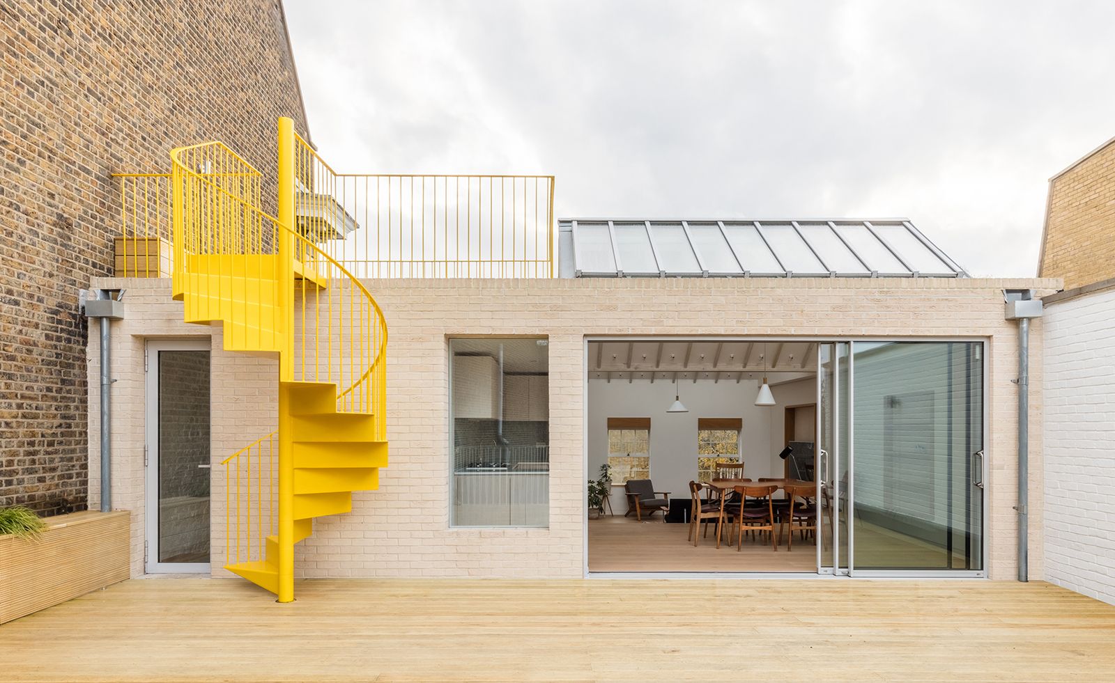 1600x981 East London apartment with yellow spiral staircase. Wallpaper*