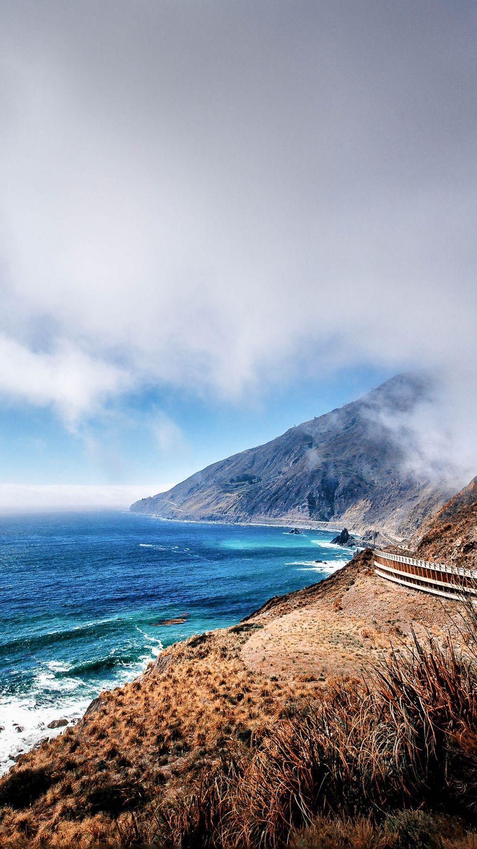 938x1668 Download wallpaper 938x1668 mountains, ocean, fog, coast
