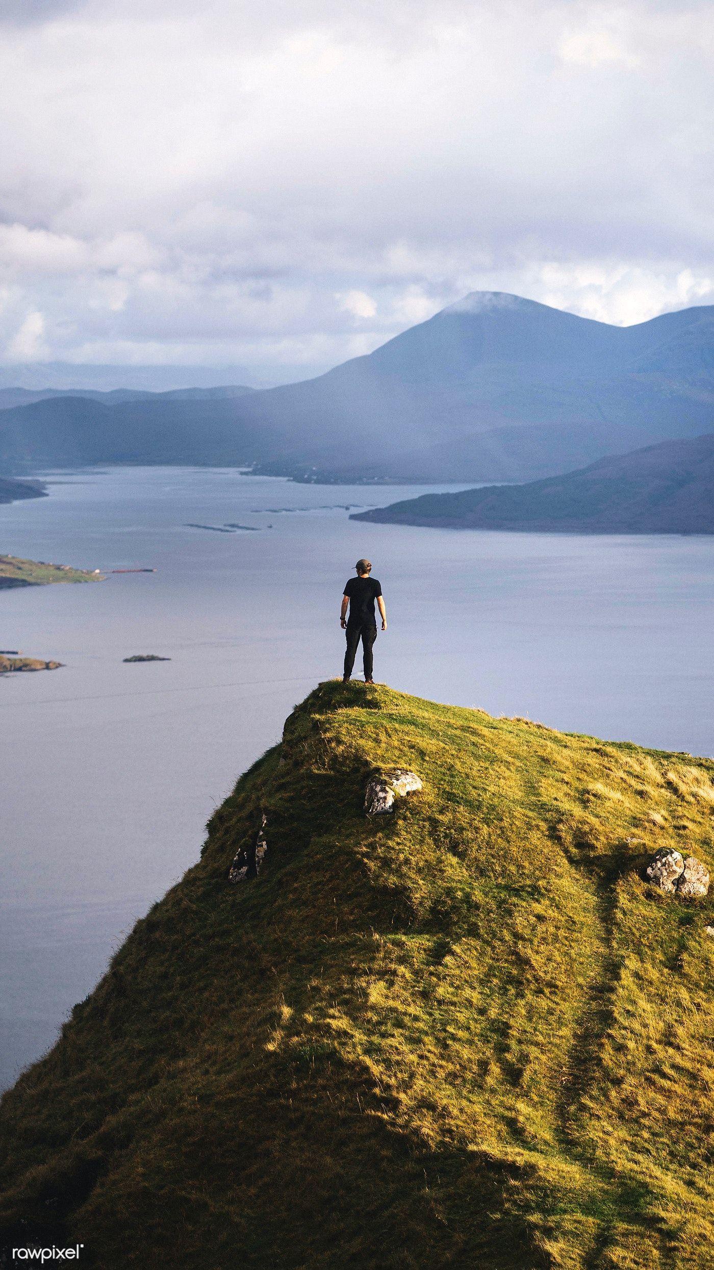1400x2490 Download premium photo of Man standing at Isle of Skye, Scotland