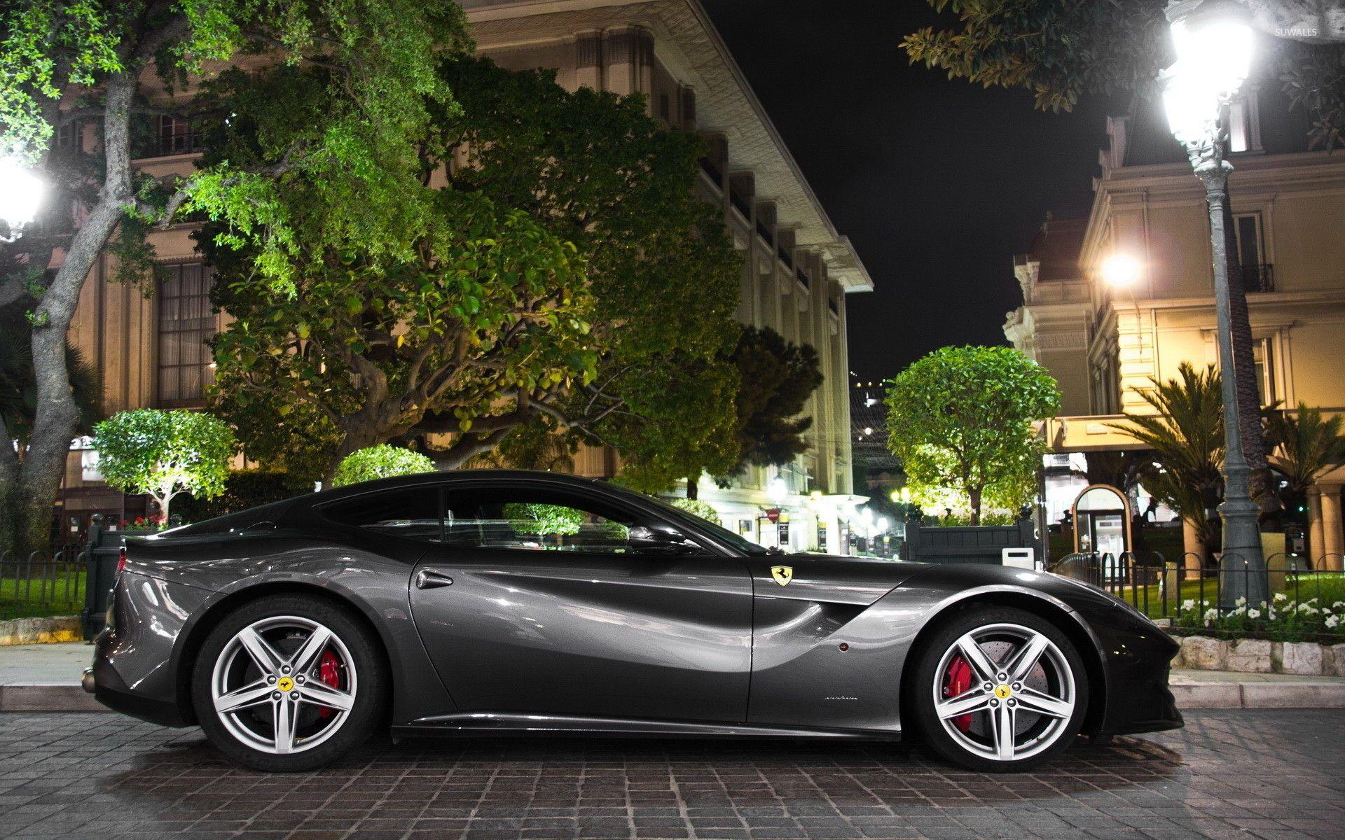 1920x1200 Side view of a black Ferrari F12 Berlinetta wallpaper
