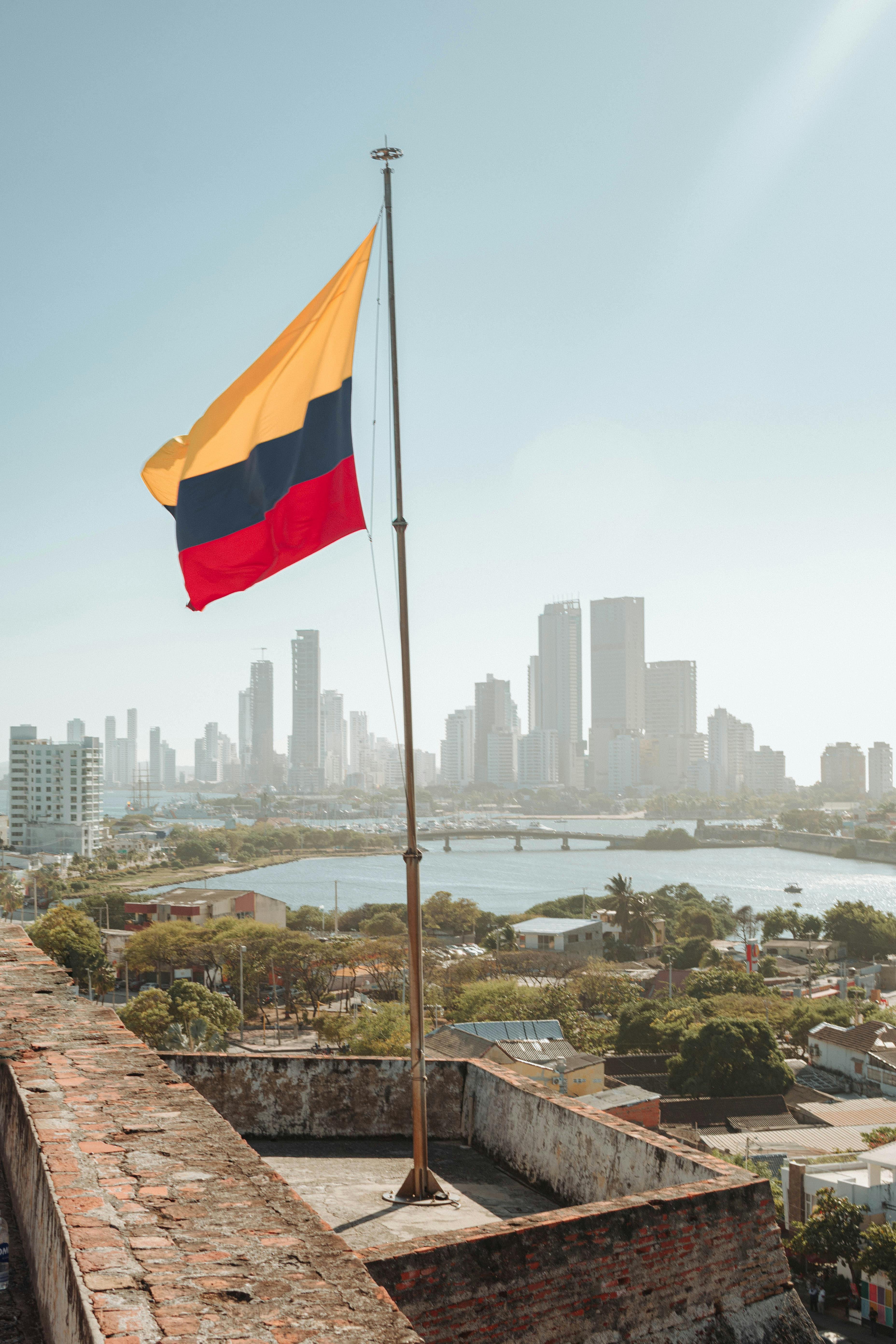 3712x5568 Colombian Flag on the Background of the Cartagena Skyline · Free