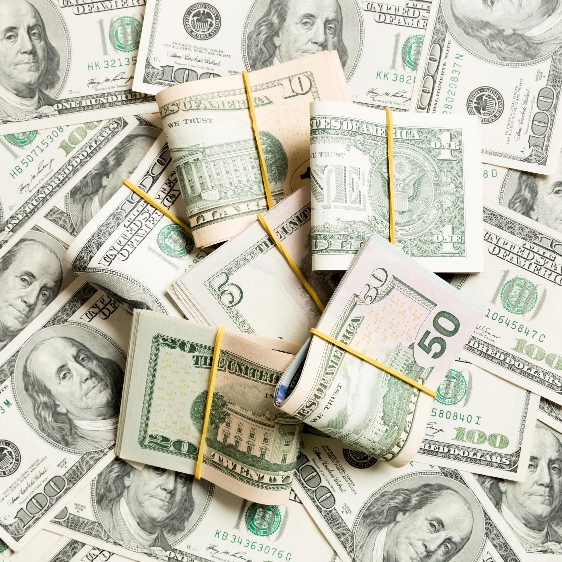 1960x1960 US Dollar bills bundles stack. one hundred dollar bills with stack of money in the middle. Top view of business concept background with copy space