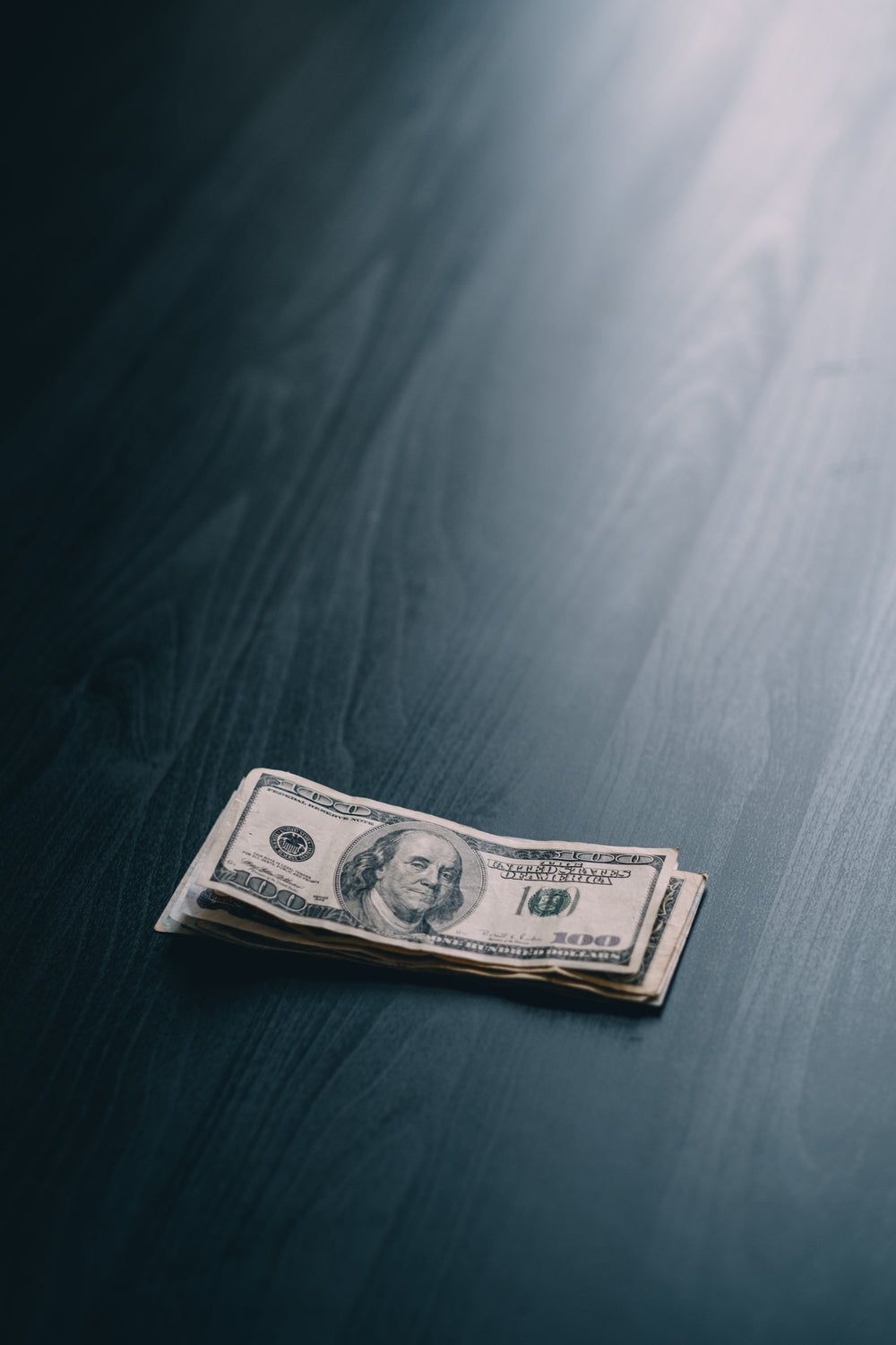 1000x1500 Picture of Hand Putting Money In Bank