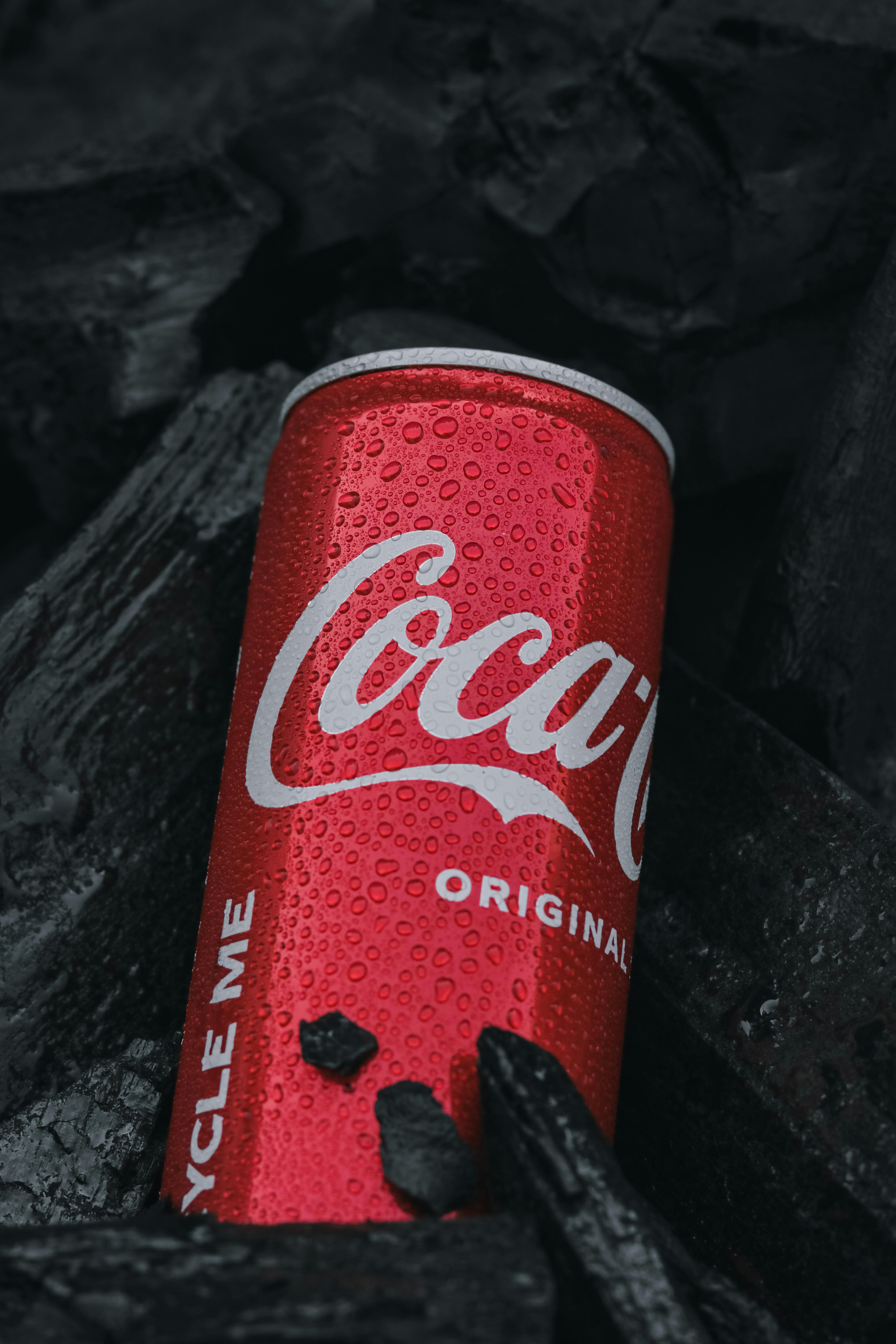 4000x6000 Wet Coca Cola Can Among Black Rocks · Free