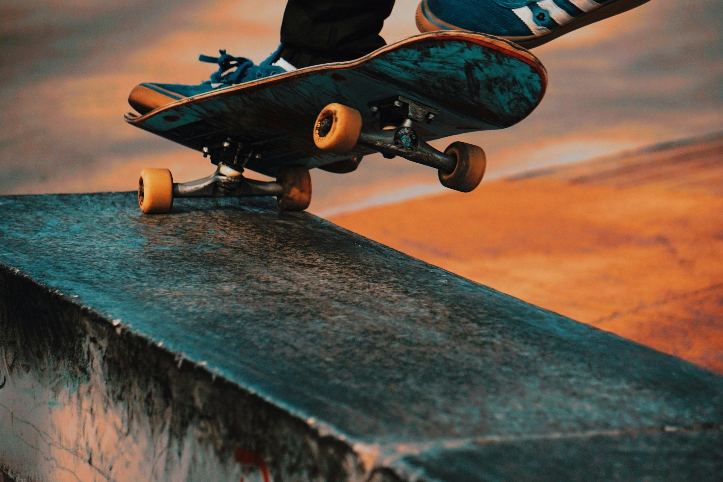 3000x2000 Person doing kick flip trick photo