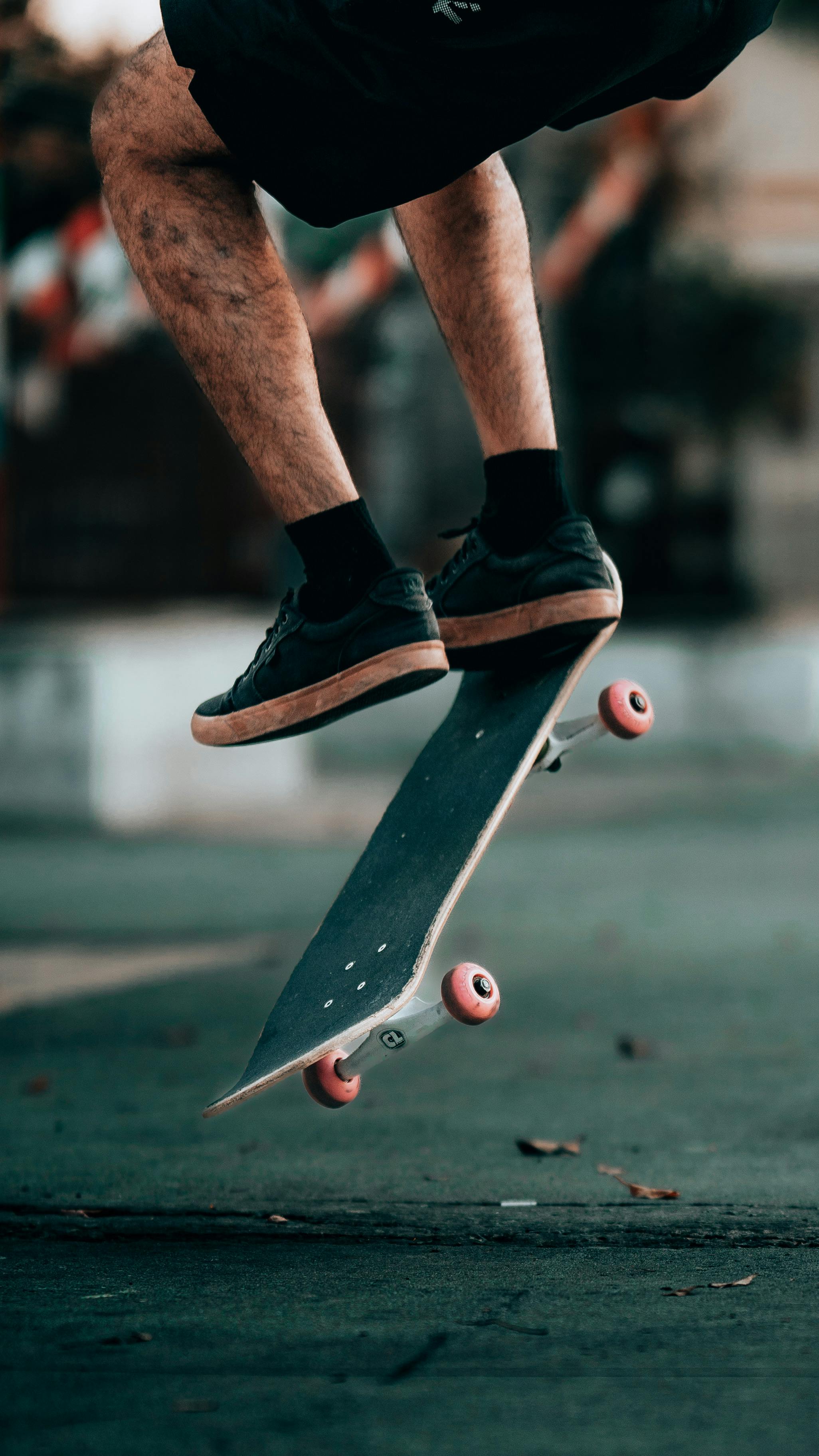 2052x3646 Person Kickflipping · Free