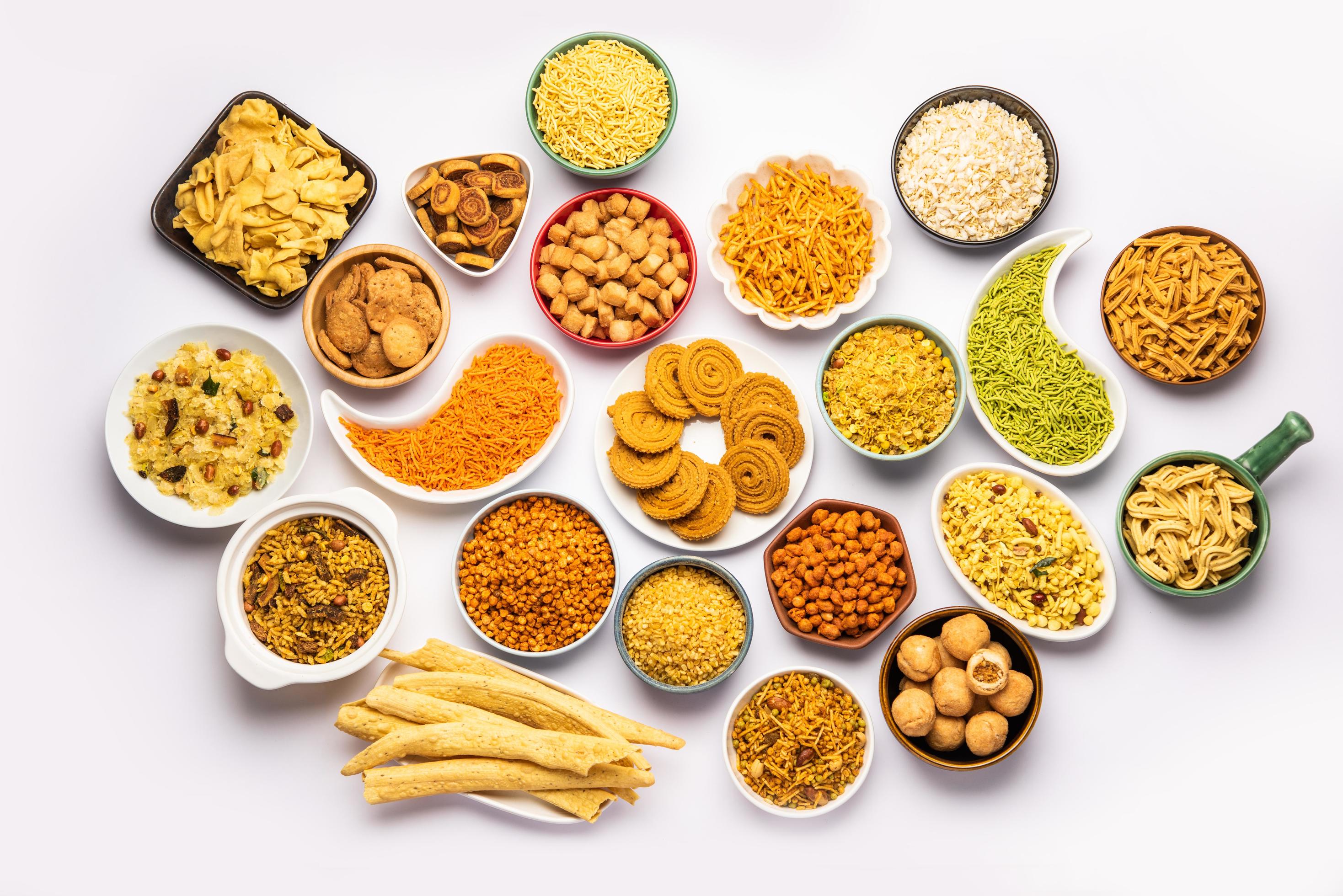 2937x1960 Indian Tea time snacks in group. Sev, chivda, farsan, mixture, bakarwadi served in different bowls