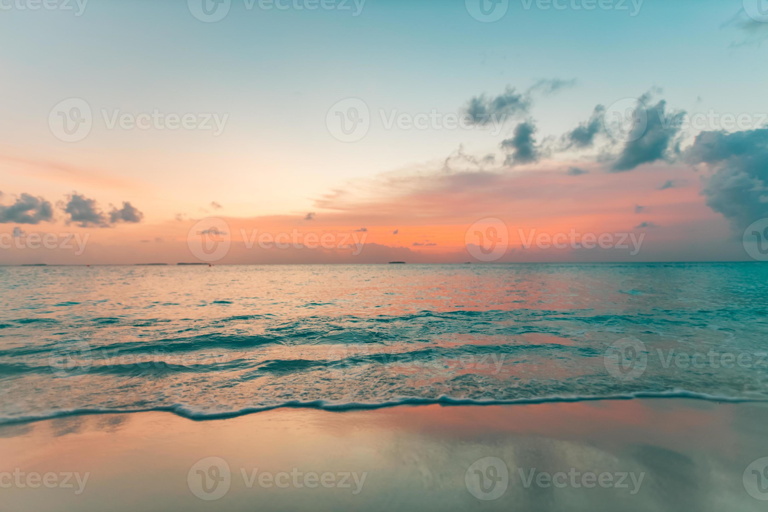 2940x1960 Empty sunset beach. Idyllic tropical beach landscape for background or wallpaper. Soft waves splashing on coastline, sun reflection, peaceful view. Design of summer vacation holiday concept