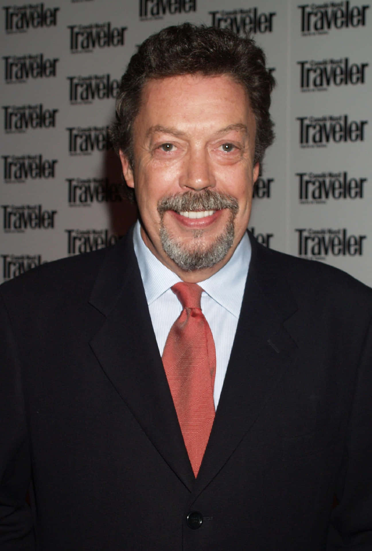 1297x1920 Download Iconic Actor Tim Curry in Classic Portrait Wallpaper
