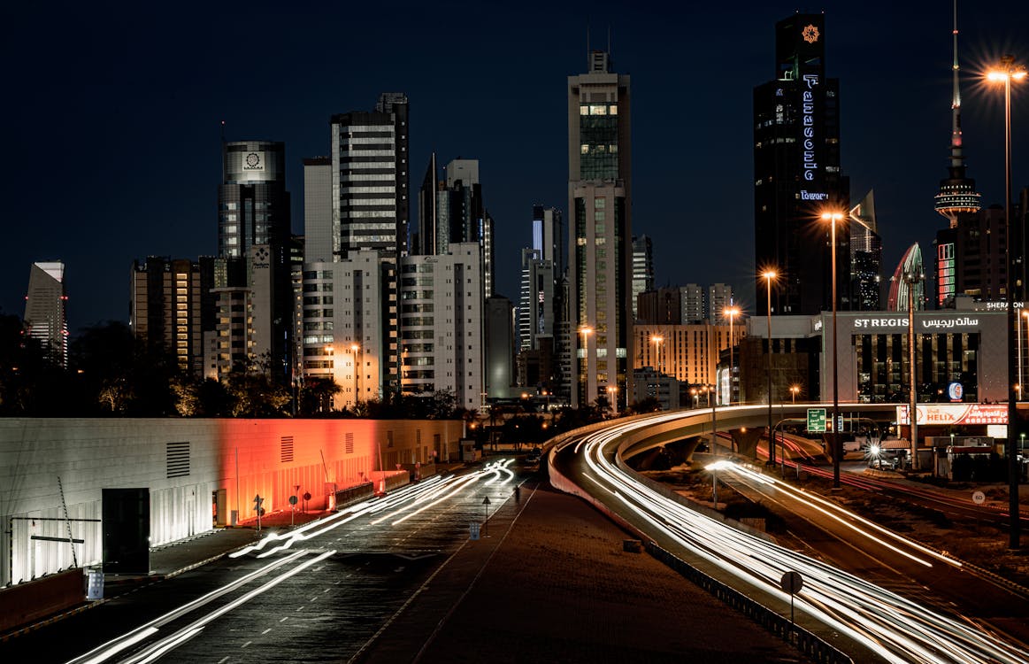 1163x750 Time Lapse of Streets in Front of Kuwait City Skyscrapers at Night · Free