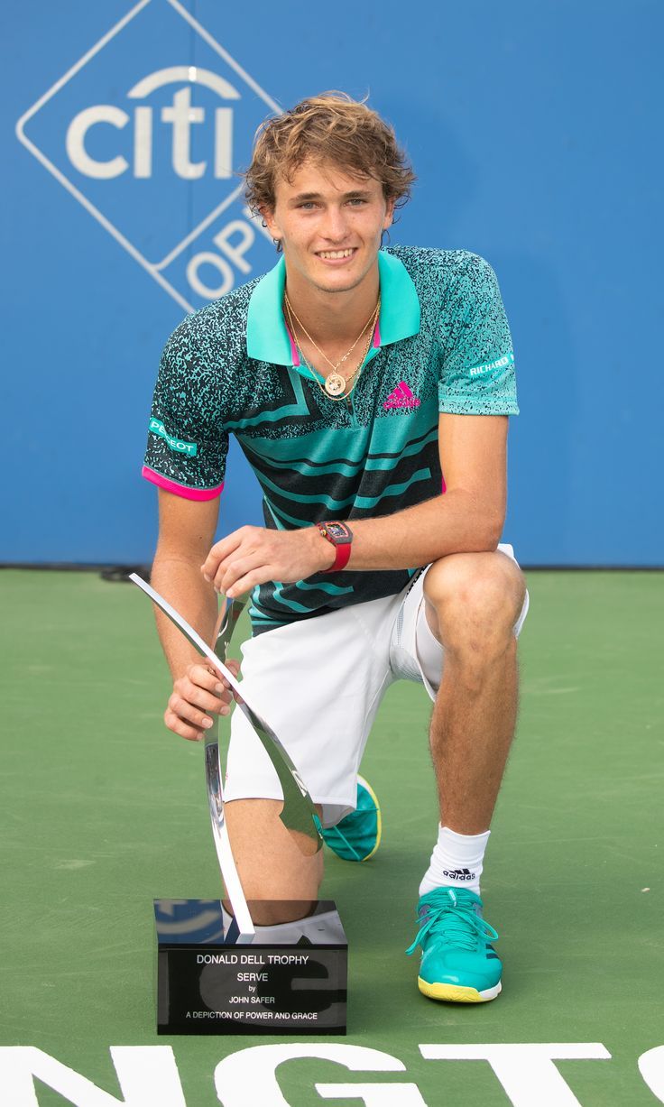 736x1227 August 2018: Alexander Zverev celebrates with the trophy after defeating Alex de Minaur in the men's singles final of the Citi Open at Rock Creek Park Tennis Center